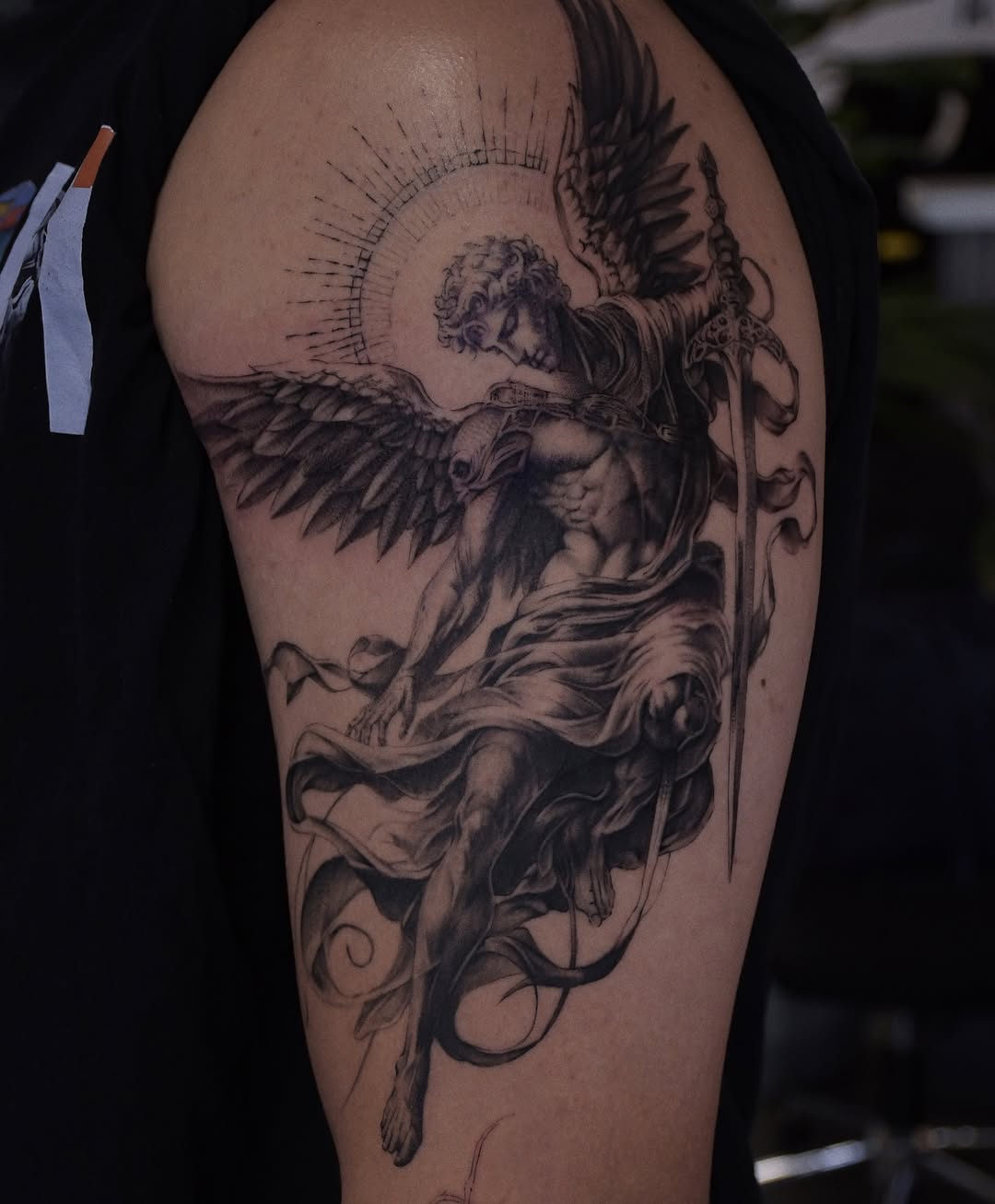 Angel with sword realism tattoo on the upper arm by Gary Zhong, Upland, California