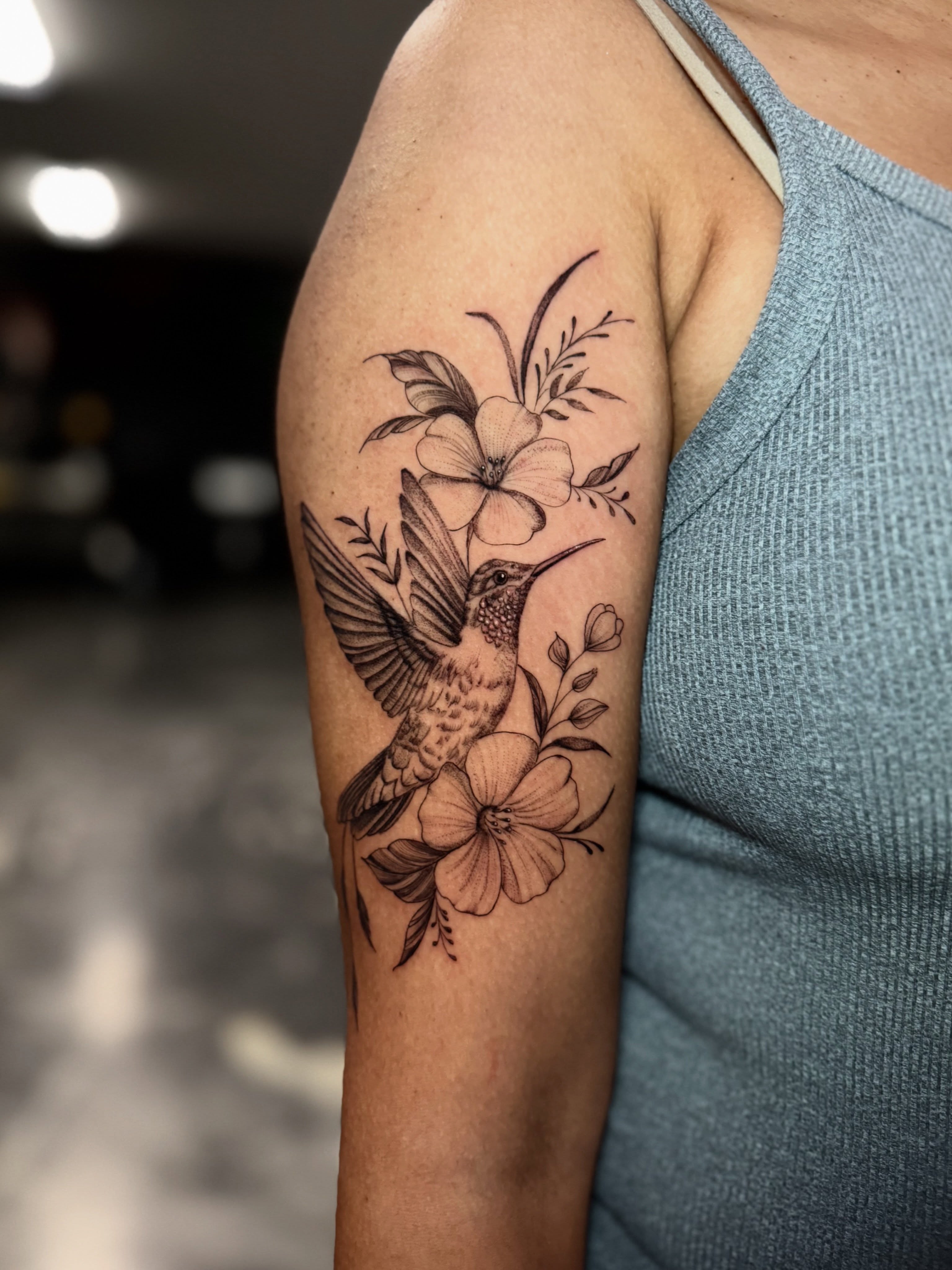 Hummingbird and flowers realism tattoo on the forearm by Paola Pineda Tattoo, Knoxville, Tennessee