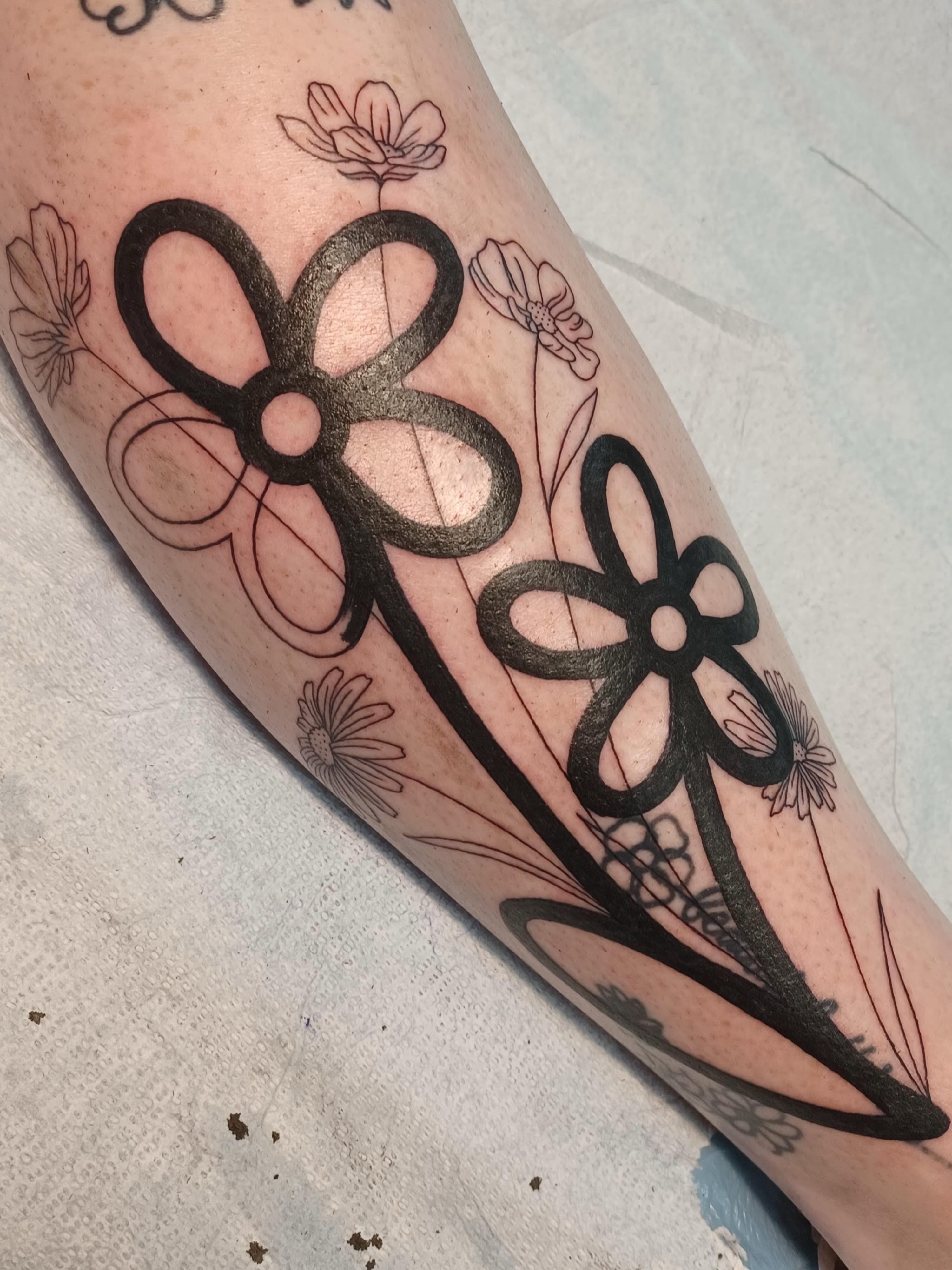 Flower black and grey tattoo on the forearm by Abi