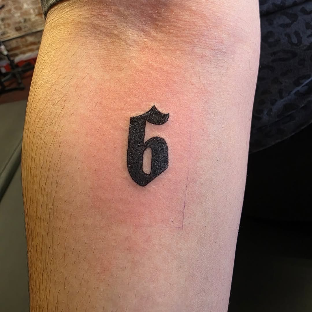 Number 6 tribal tattoo on the forearm by Tattoos by Annie