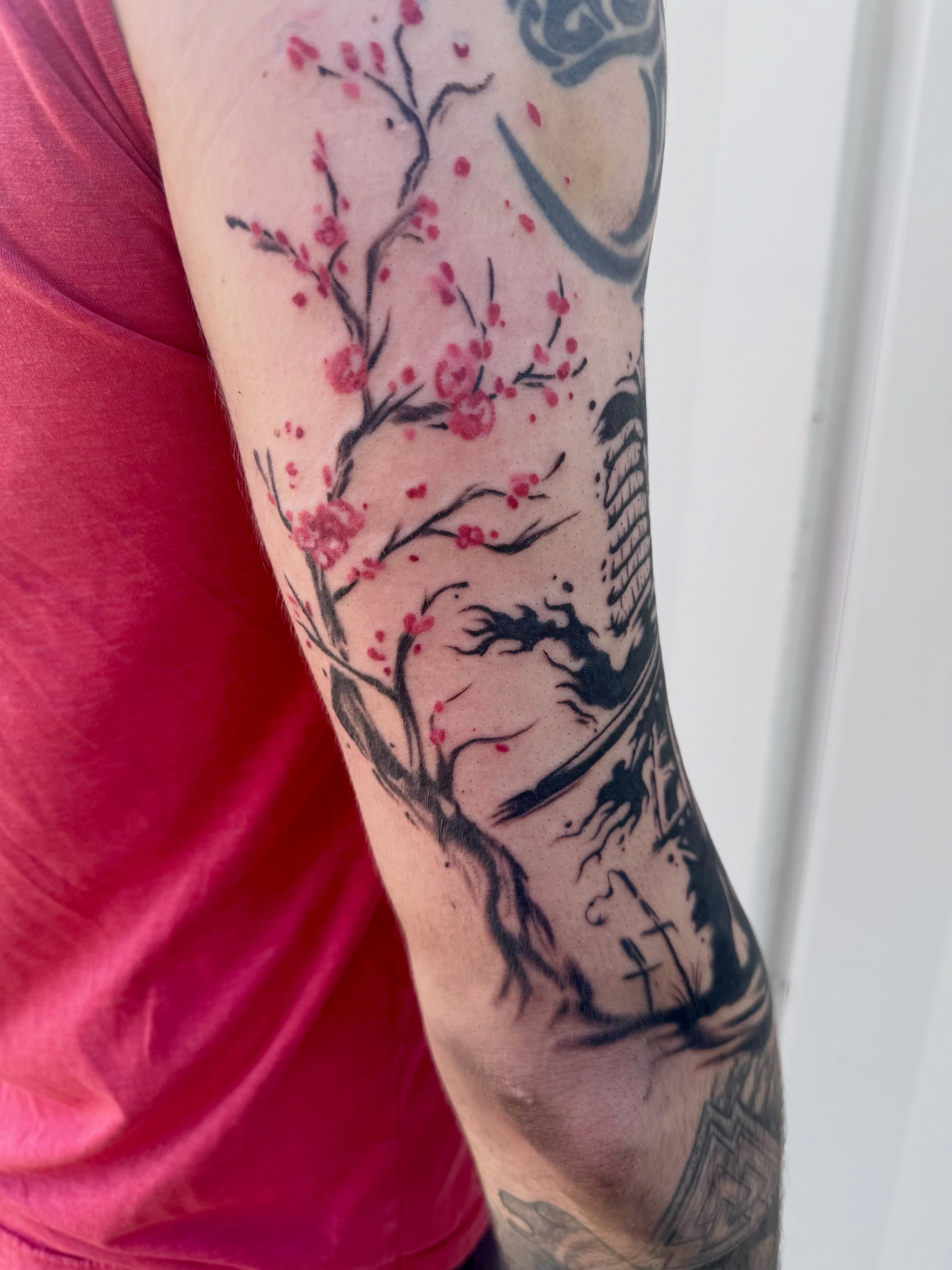 Cherry blossom tree black and grey tattoo on the forearm by Caitlynn Austin