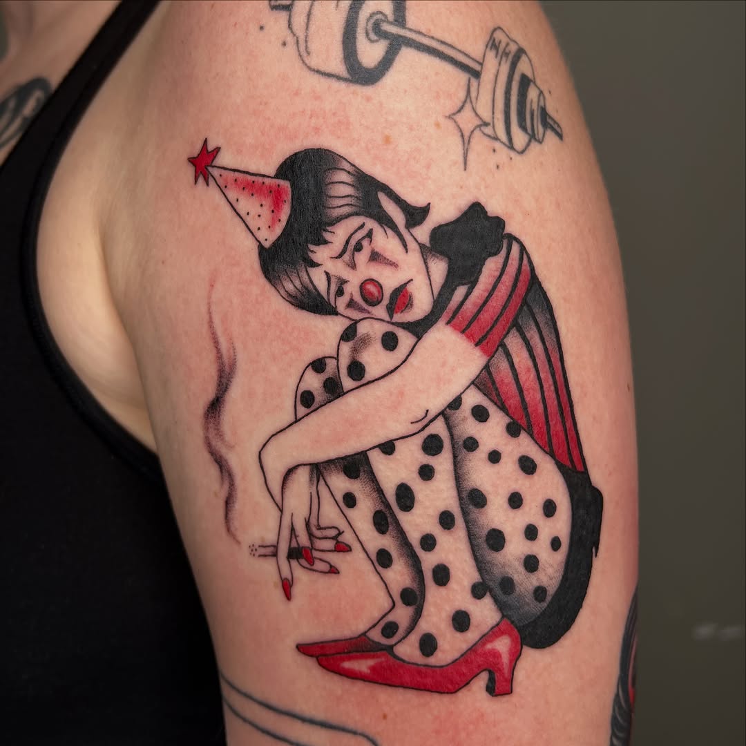 Sad clown smoking neo-traditional tattoo on the upper arm by Elleree (LRE)