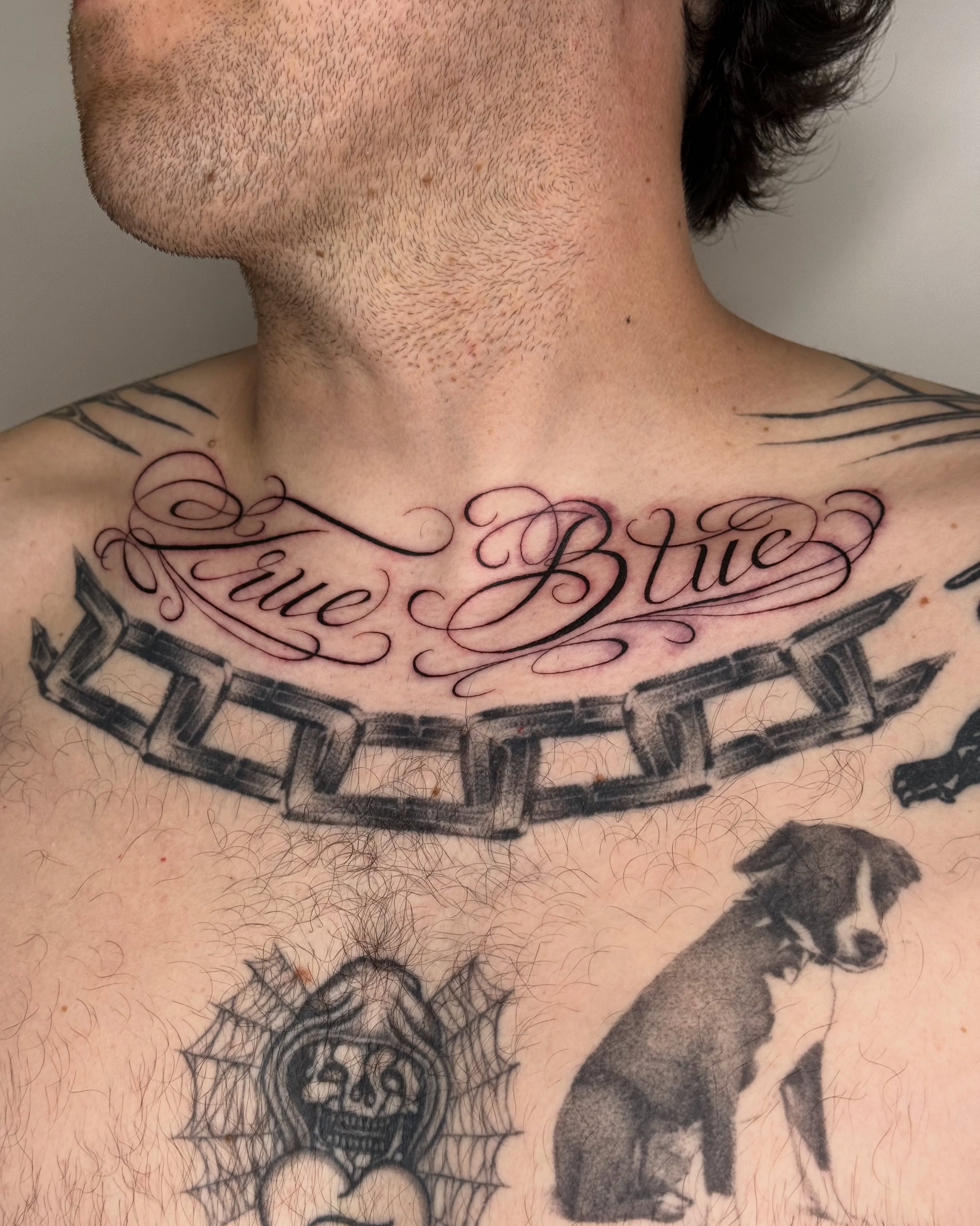 Chain and script black and grey tattoo on the chest by IVY