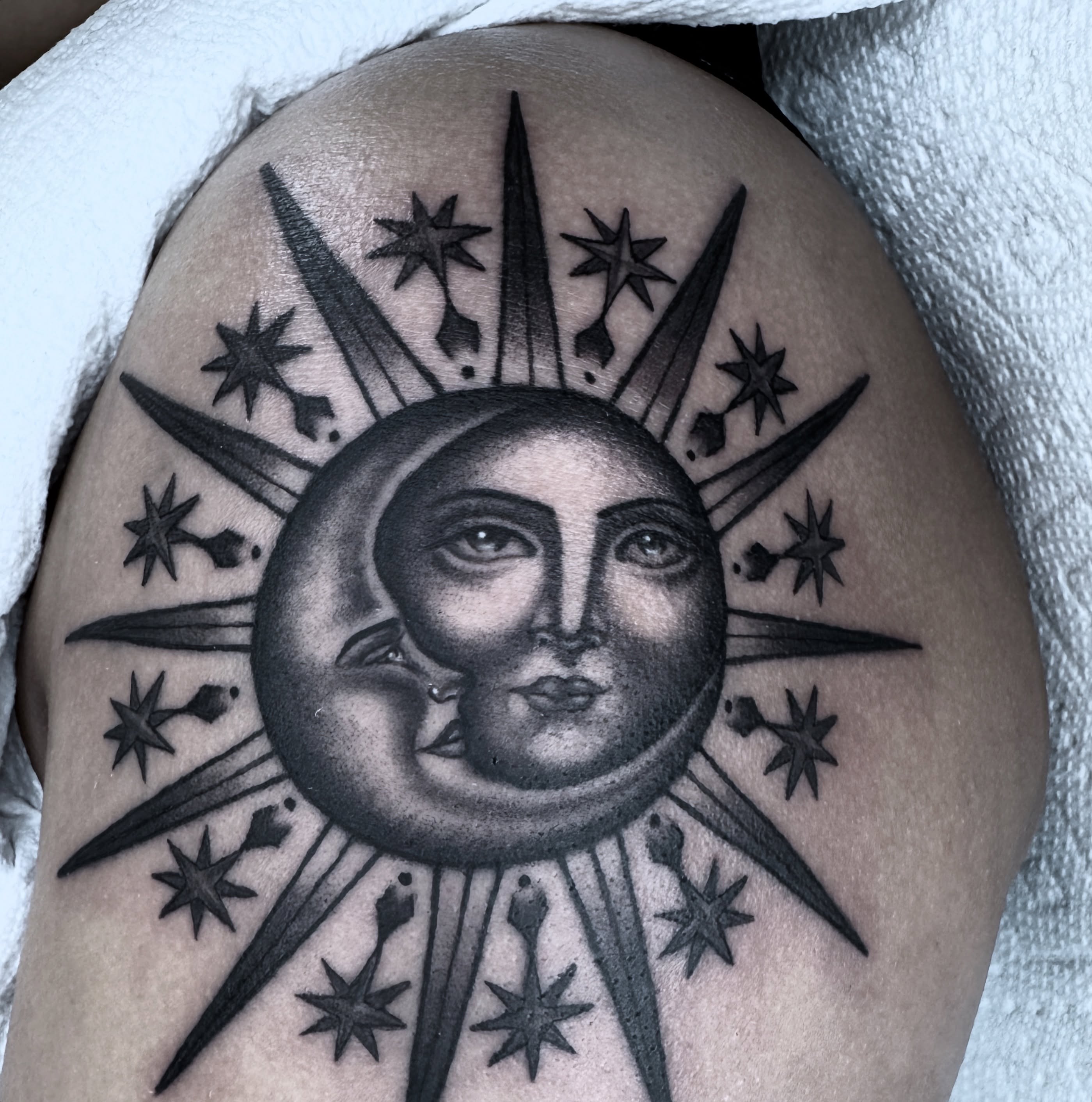 Moon and stars realism tattoo on the shoulder by Lisa Del Toro