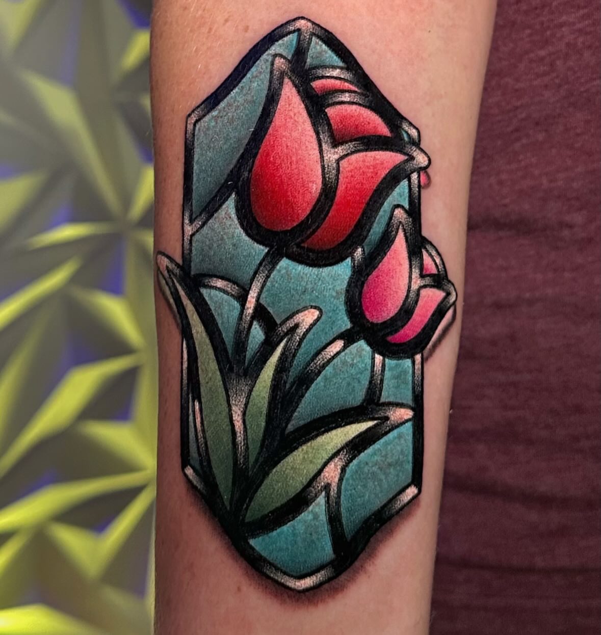 Tulips American traditional tattoo on the forearm by Chi, Charlotte, North Carolina