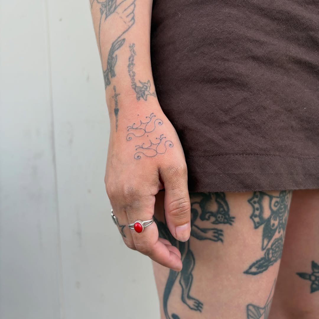 Swirls geometric tattoo on the forearm by kari