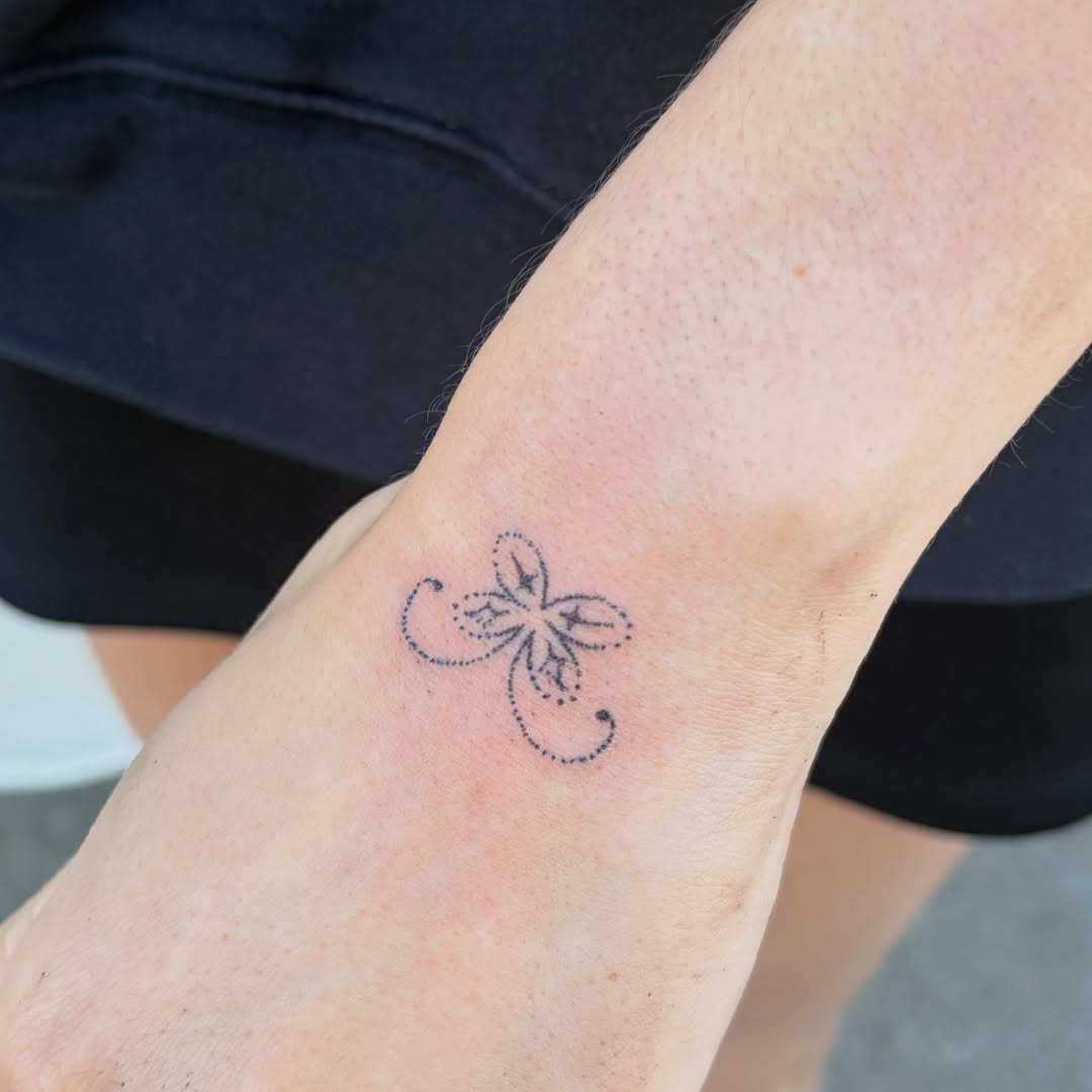 Butterfly dotwork tattoo on the forearm by kari