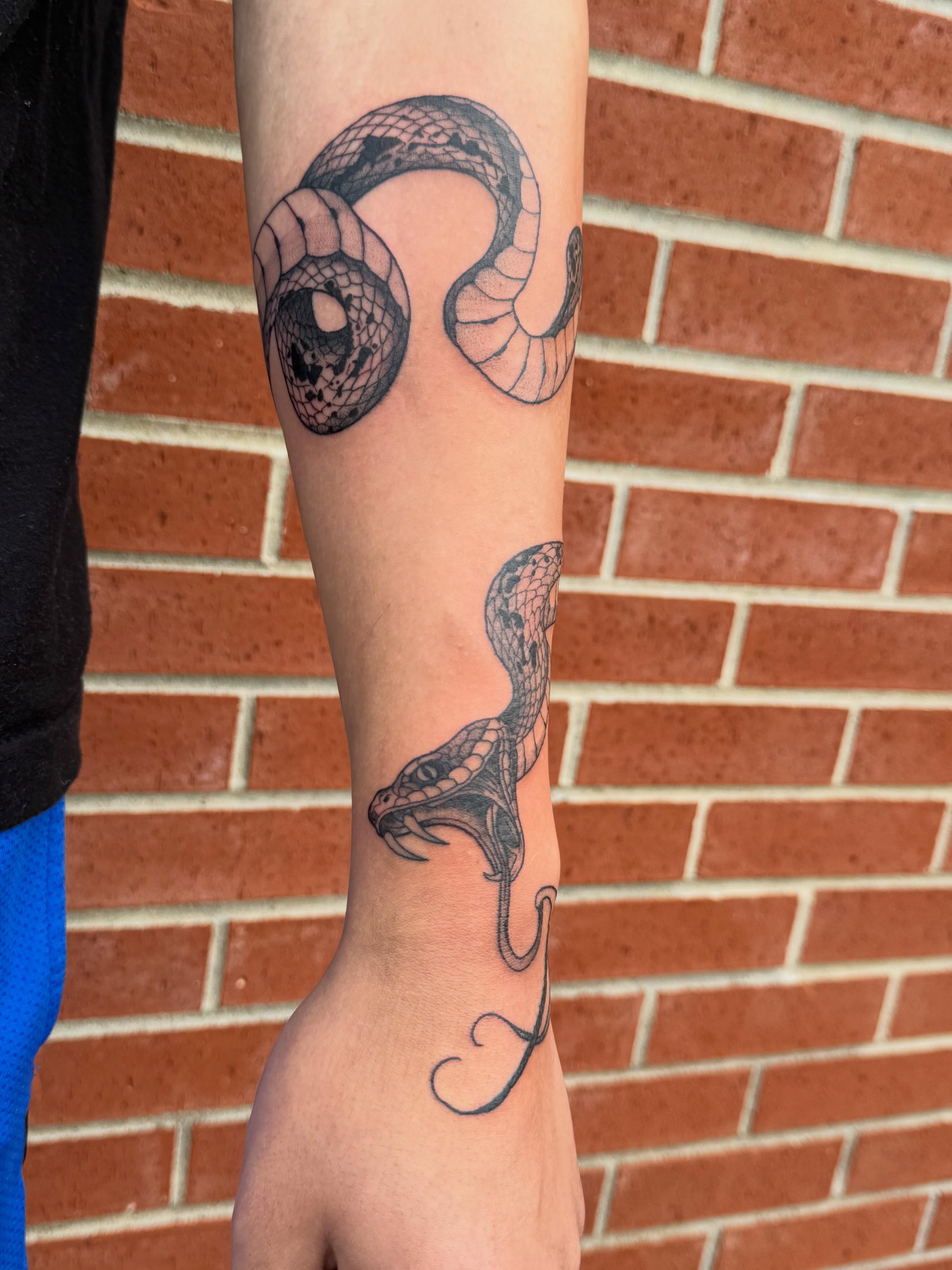 Snake black and grey tattoo on the forearm by Aly Rucker, Murfreesboro, Tennessee