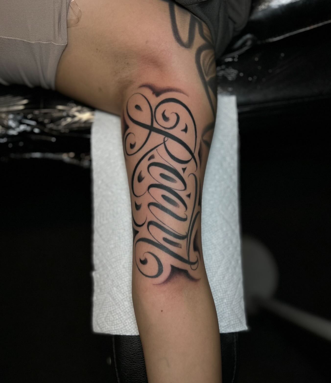 Script lettering lettering script tattoo on the forearm by Tattoo Artist