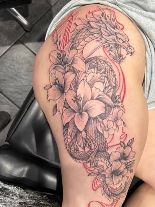 Dragon and flowers japanese irezumi tattoo on the thigh by Dave Potavin, Erlanger, Kentucky