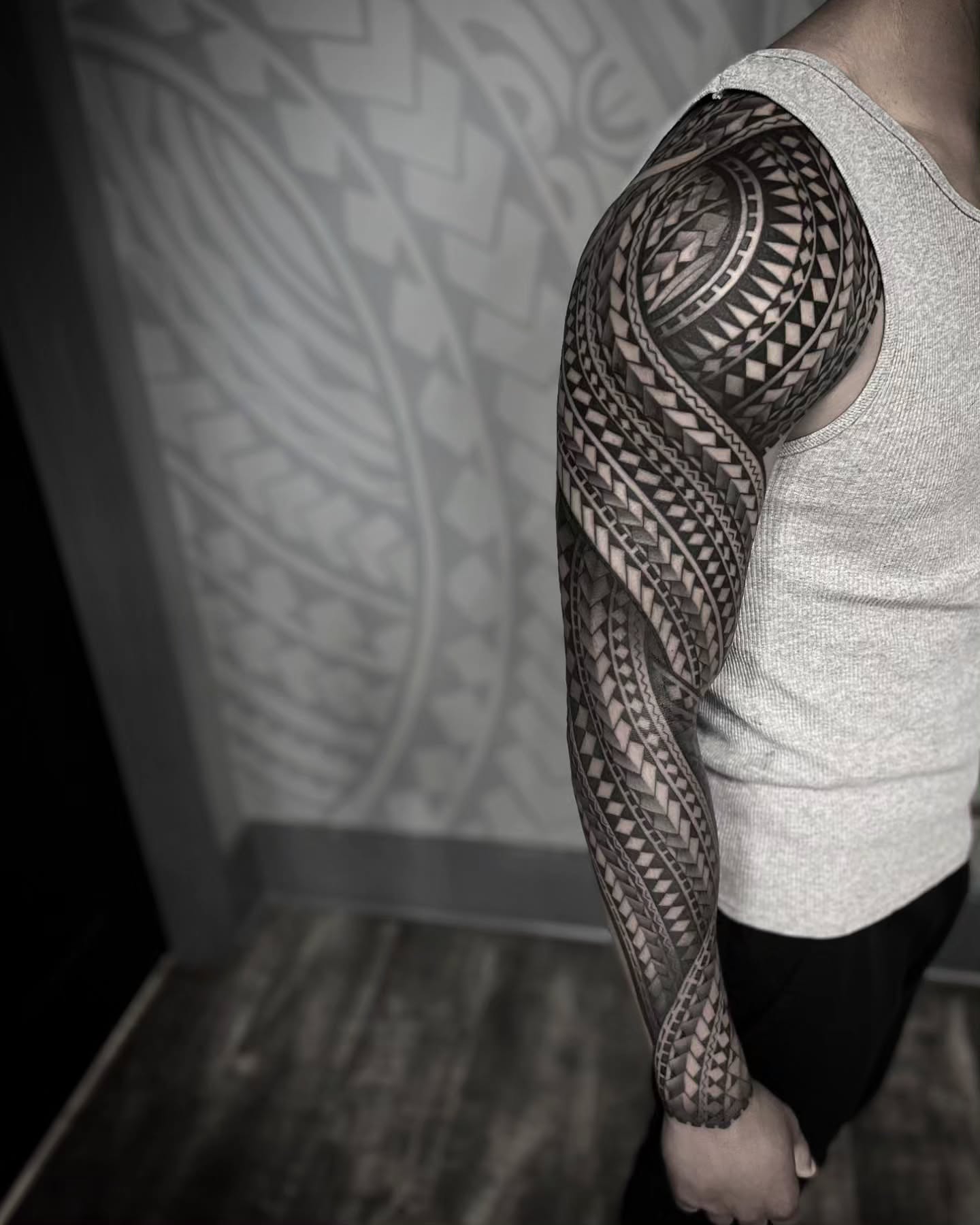 Tribal pattern tribal tattoo on the upper arm by TATTOOS by DESMOND