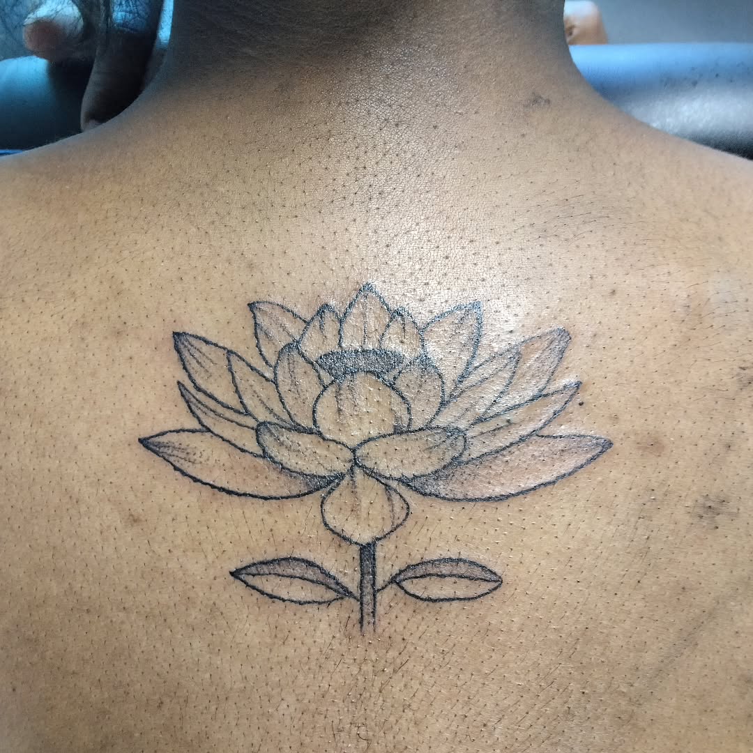 Lotus flower dotwork tattoo on the back by Malynda