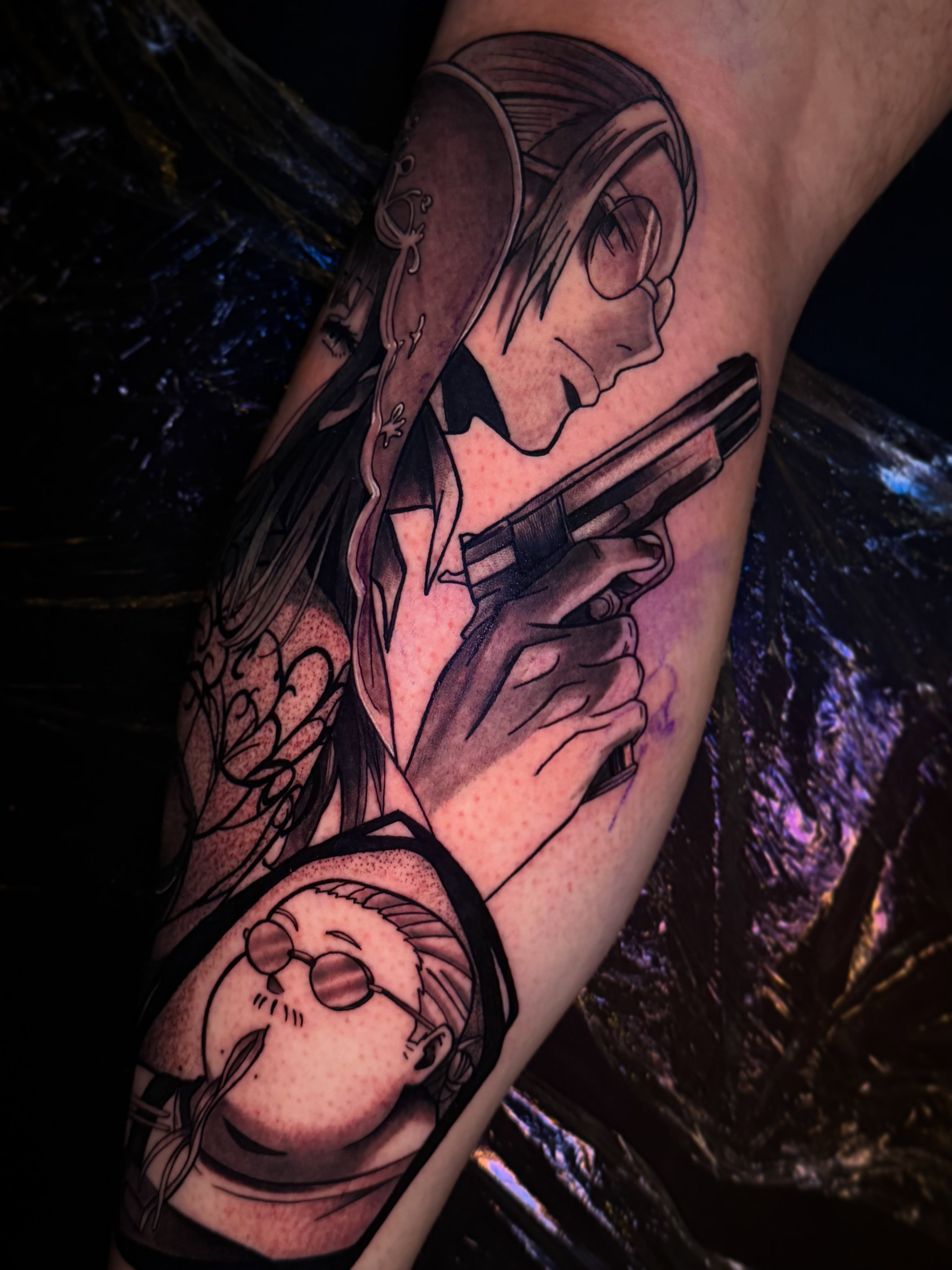 Anime character with gun anime tattoo on the forearm by Aiden Madrigal