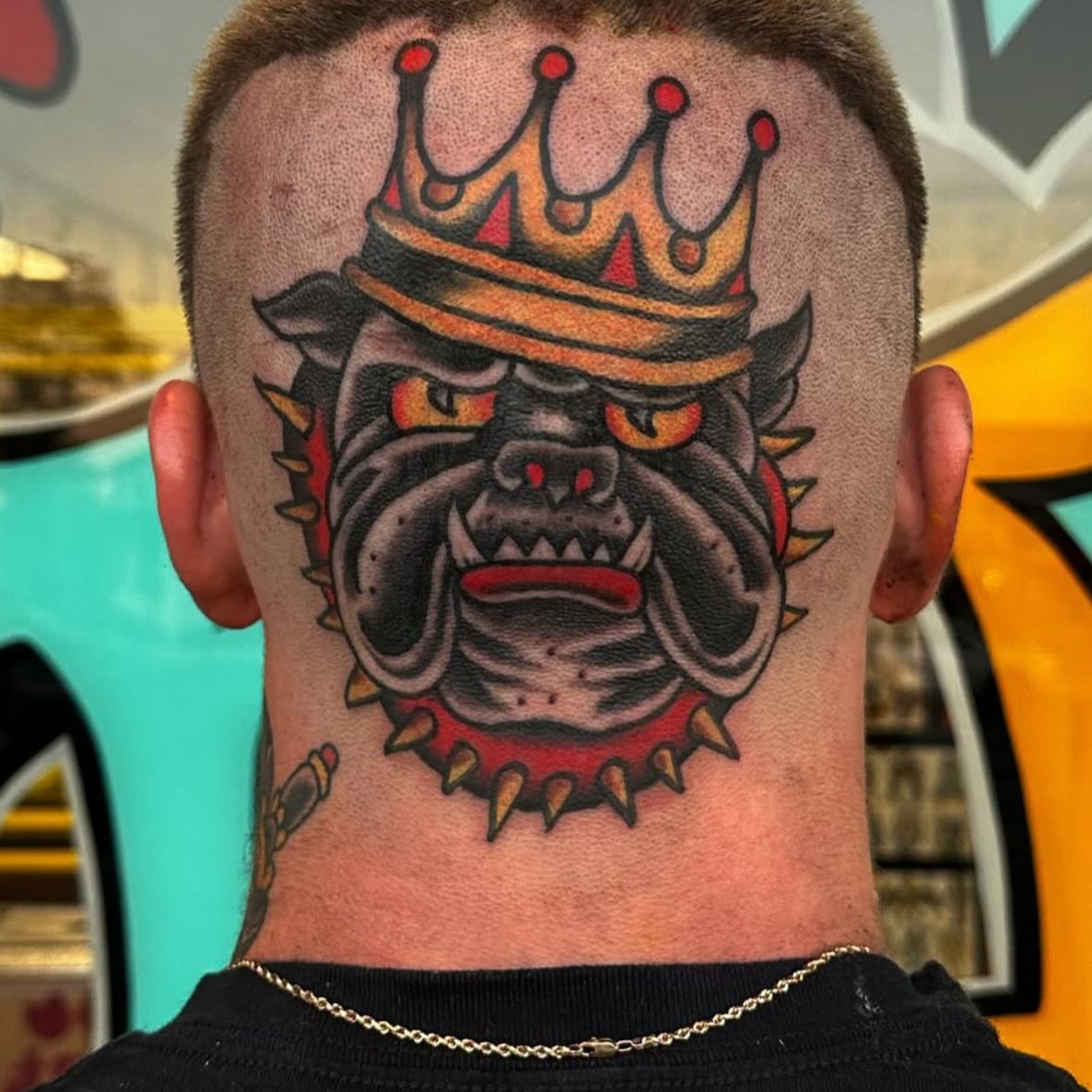 Bulldog wearing crown American traditional tattoo on the neck by Rob, Nashville, Tennessee