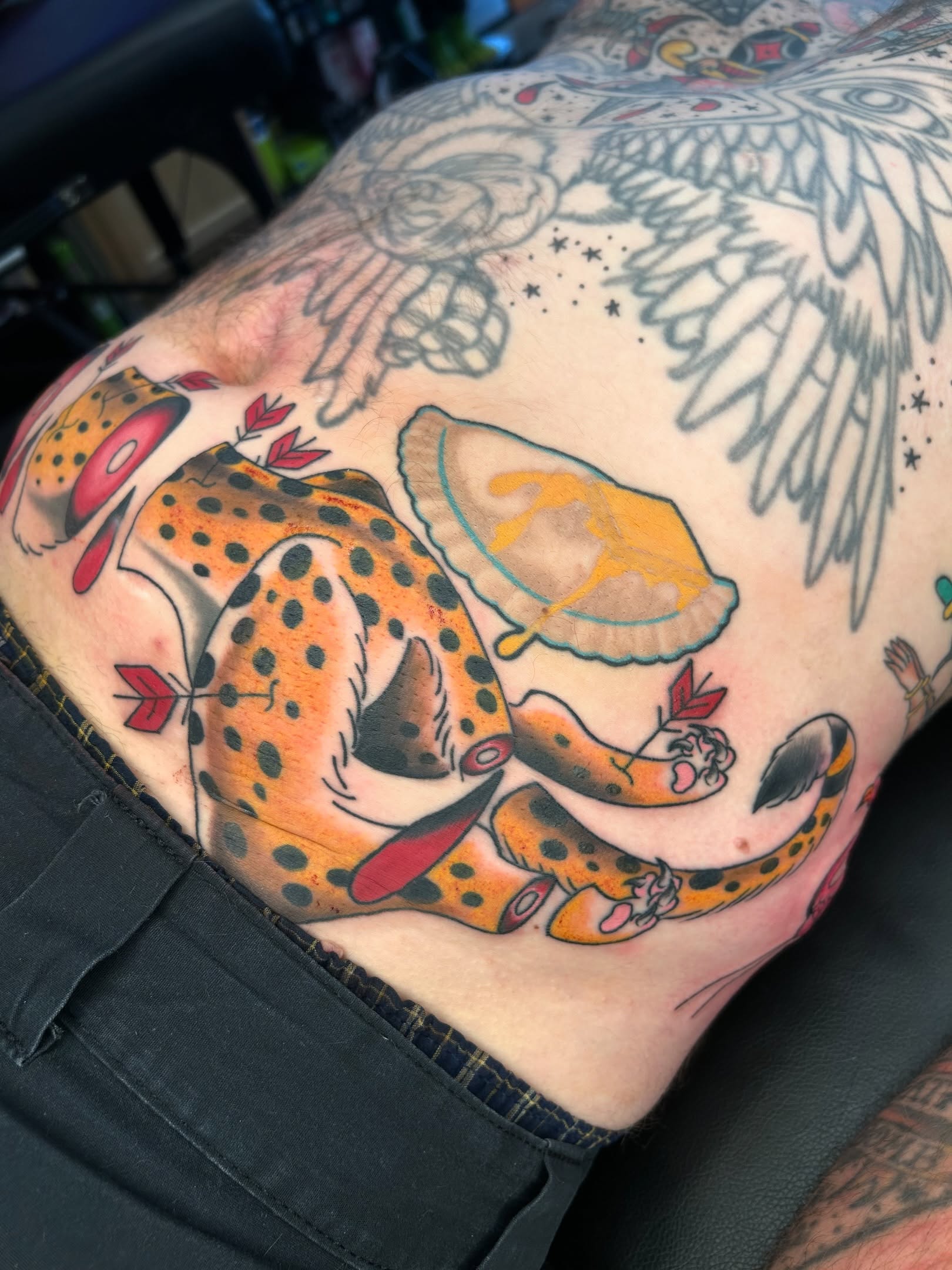 Cheetah and mushroom American traditional tattoo on the thigh by Audrey Migitsch