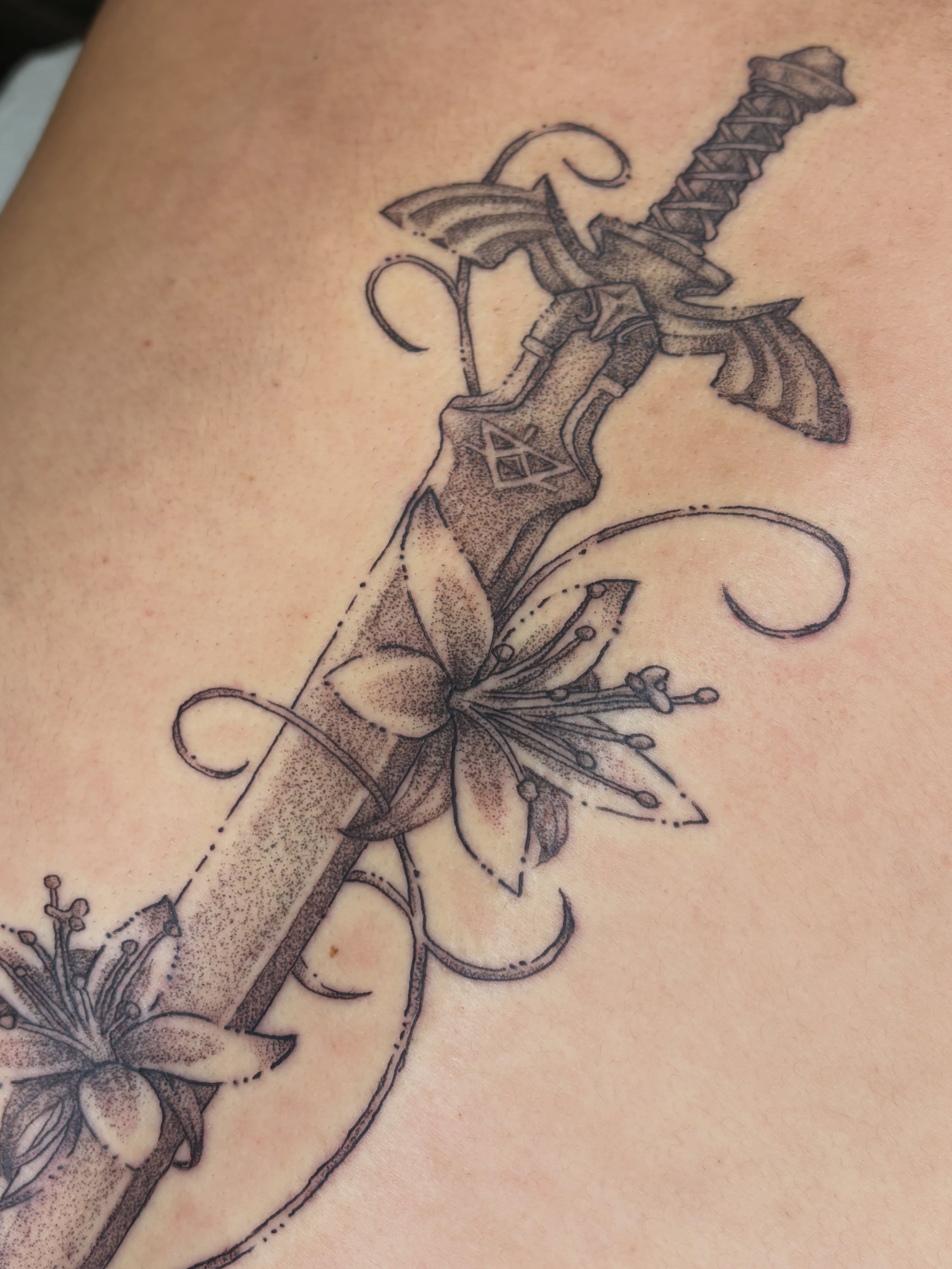 Sword and flowers dotwork tattoo on the thigh by san diego tattoo artist ✩, San Diego, California