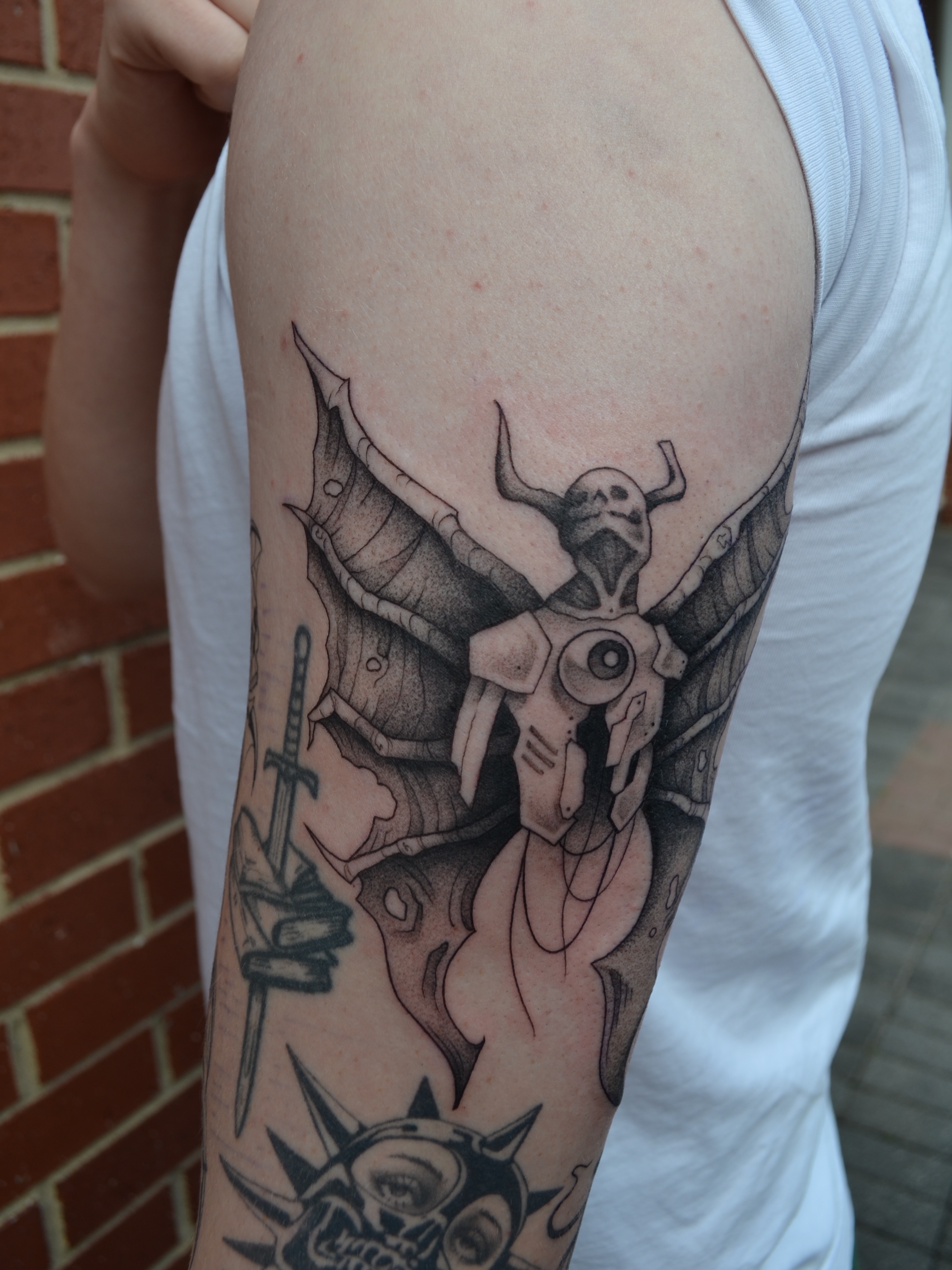 Cyborg angel geometric tattoo on the forearm by Vanessa Acosta