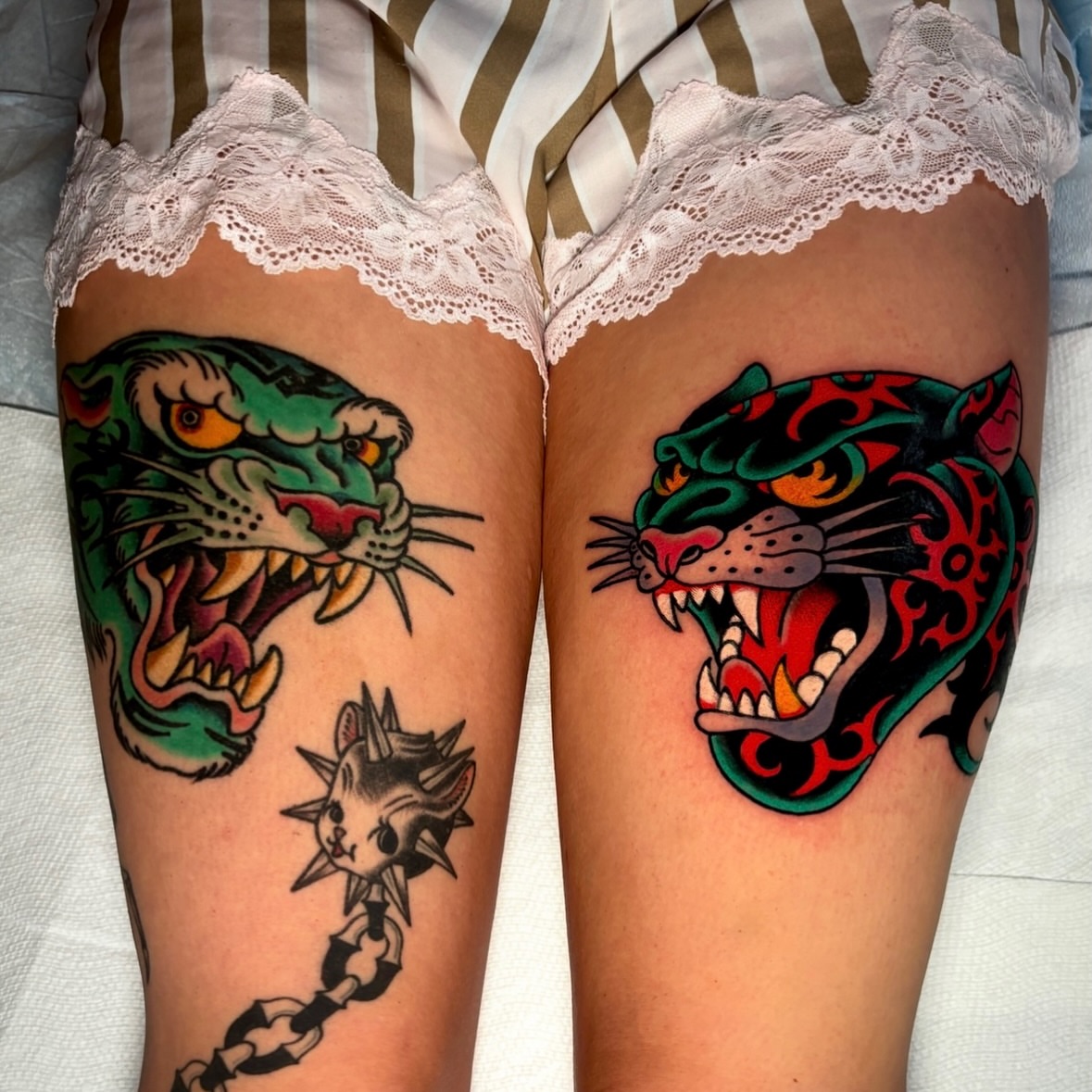 Panthers American traditional tattoo on the thigh by Mickey Putillo, Charlotte, North Carolina
