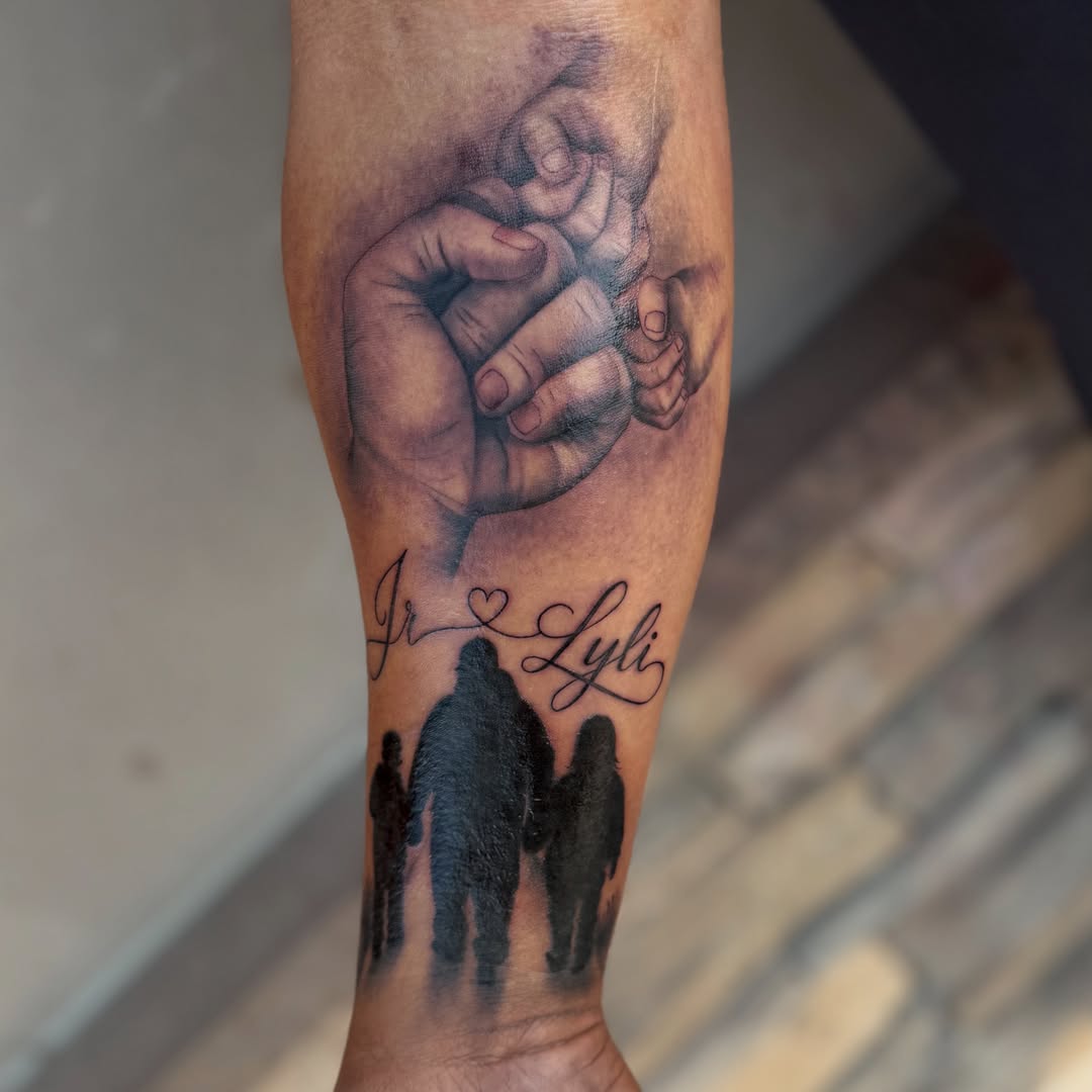 Family hands realism tattoo on the forearm by Faith Lopez