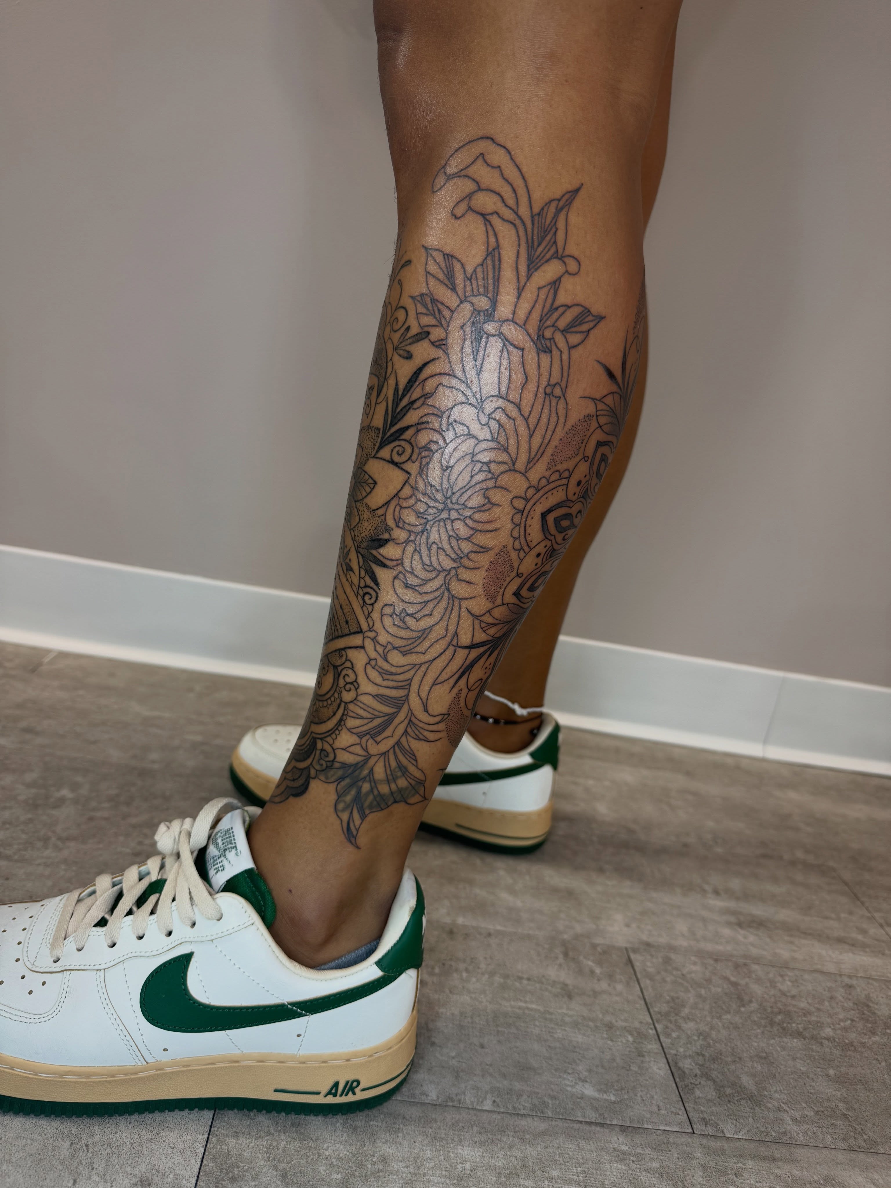 Floral design black and grey tattoo on the calf by Tara Crespi - Female Tattoo Artist 💜