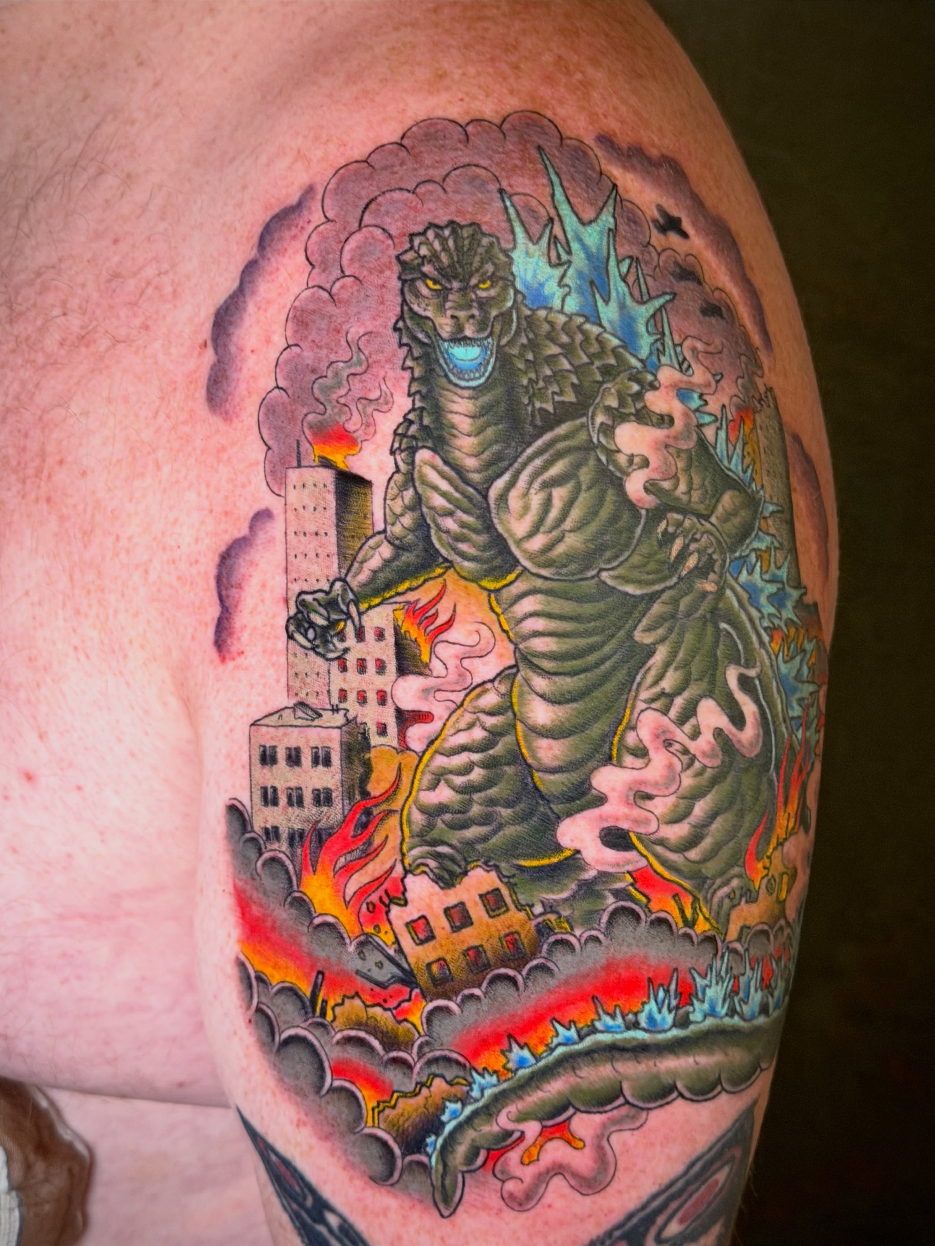 Godzilla American traditional tattoo on the shoulder by Thad Collis