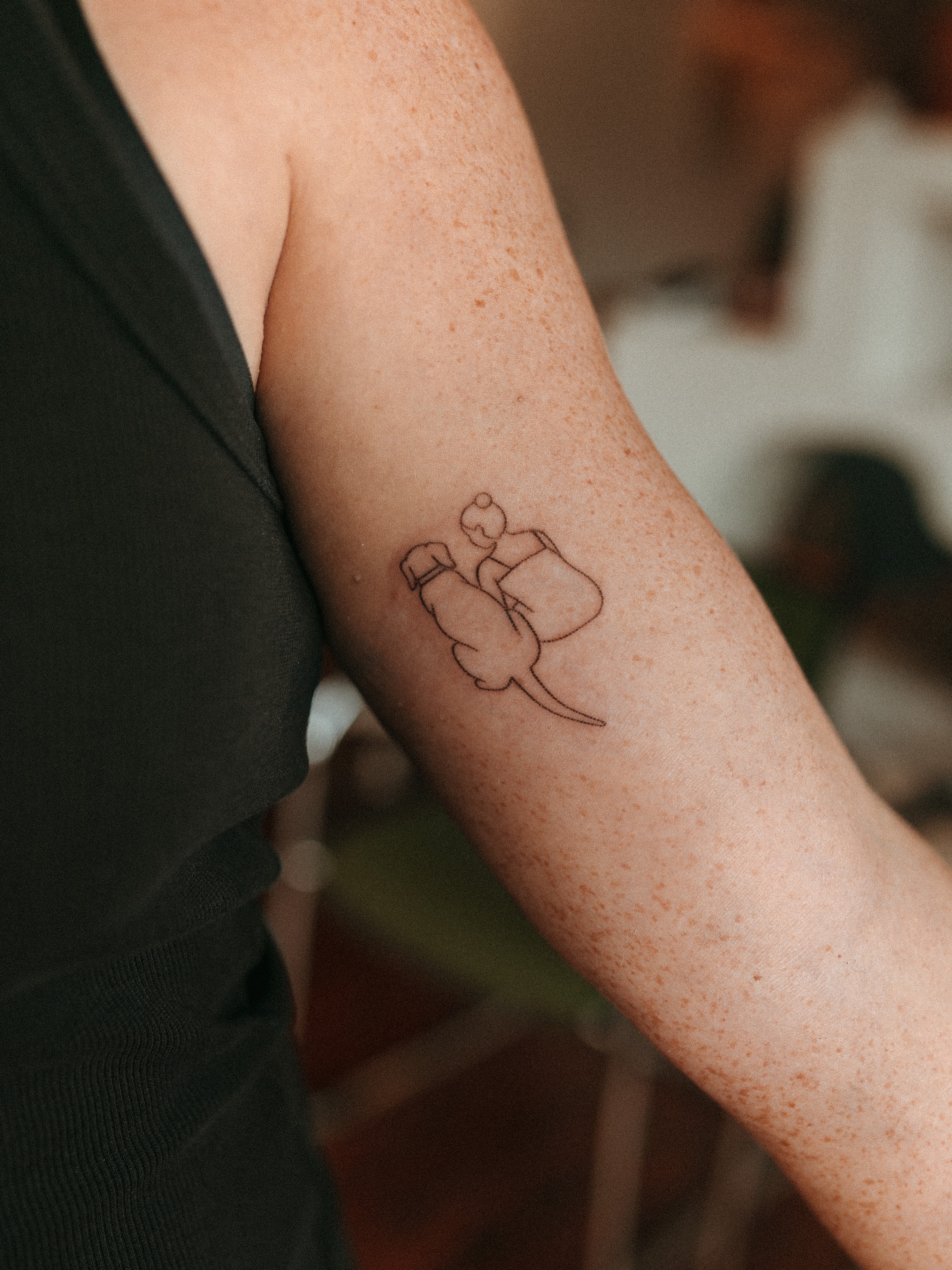 Person riding elephant fine line tattoo on the forearm by Grace Wise - Handpoke Tattoos