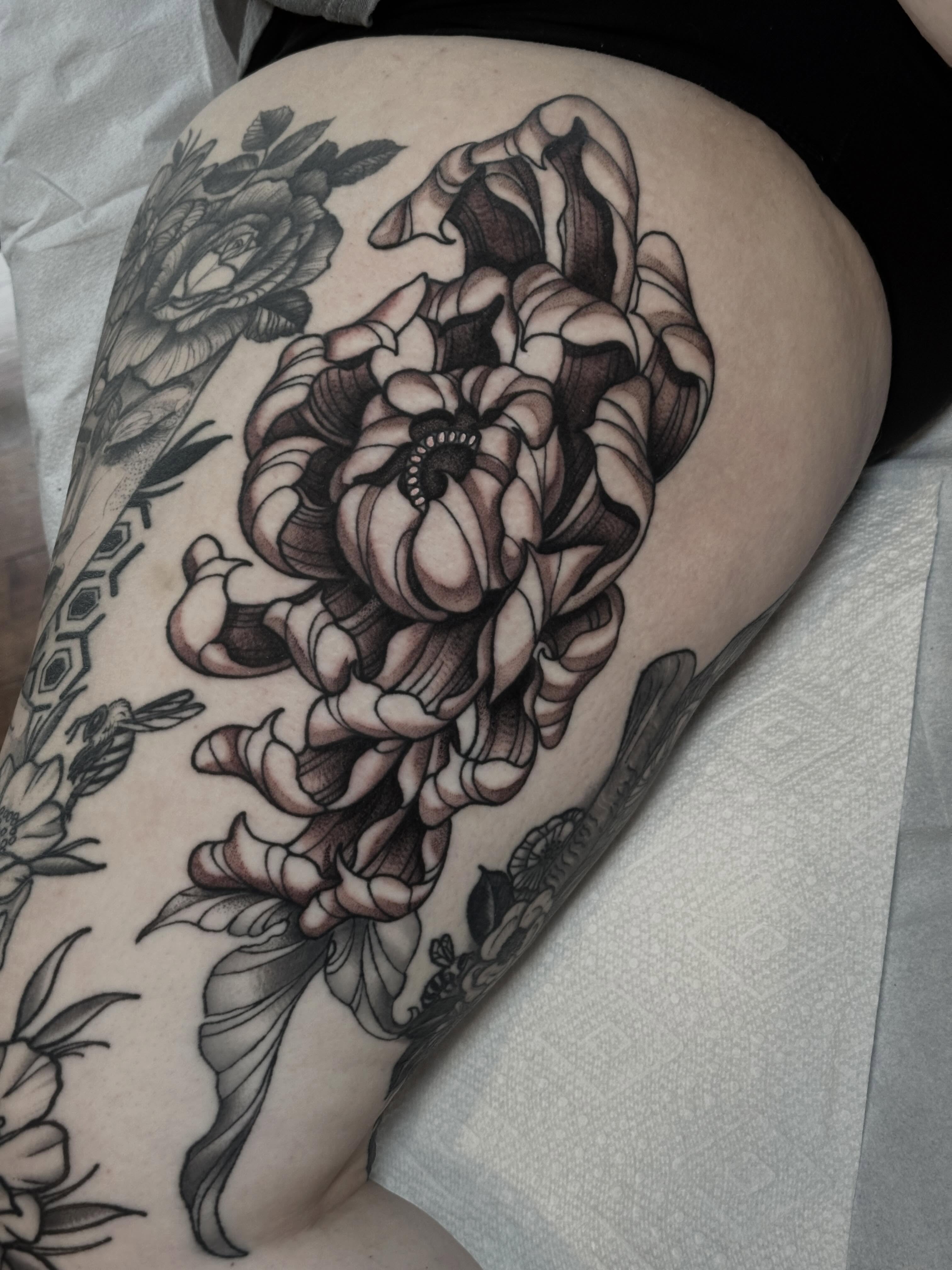 Peony black and grey tattoo on the thigh by Liz McDonald