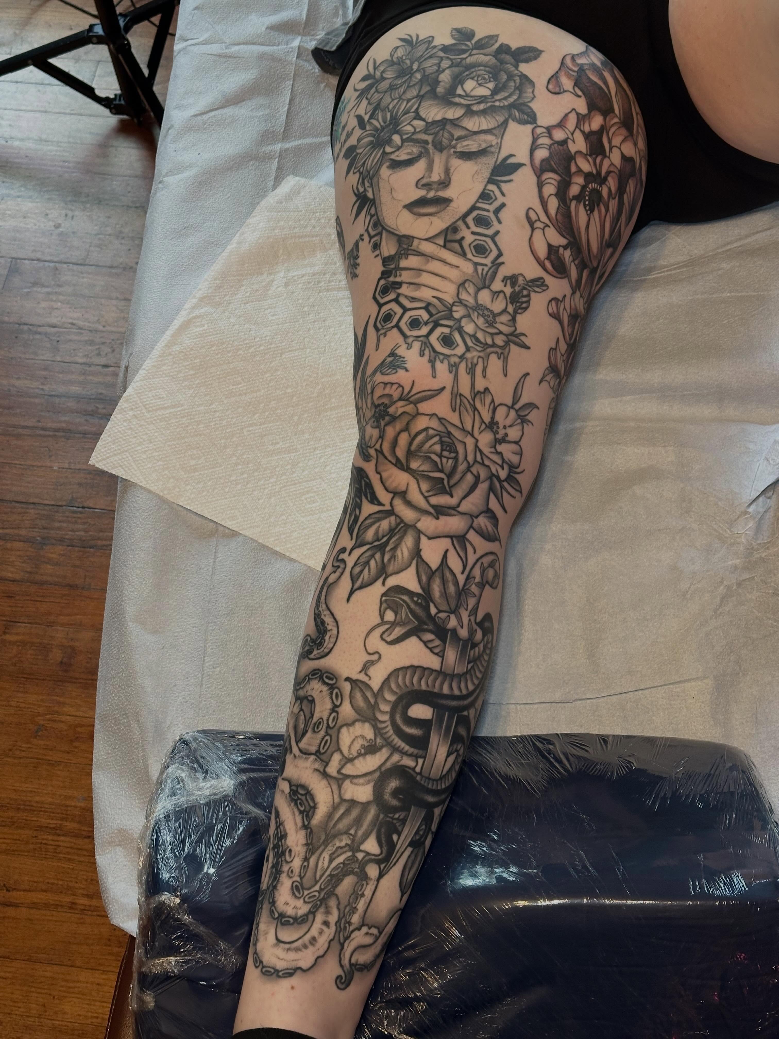 Floral woman American traditional tattoo on the thigh by Liz McDonald