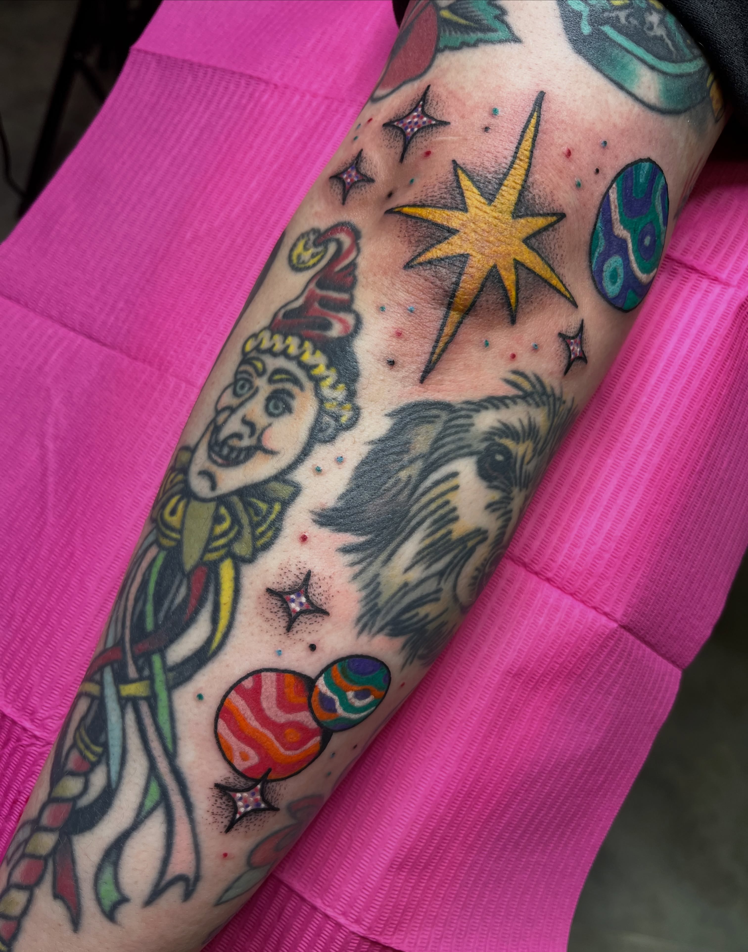 Astronaut and planets American traditional tattoo on the forearm by Cincinnati Tattoo Artist, Cincinnati