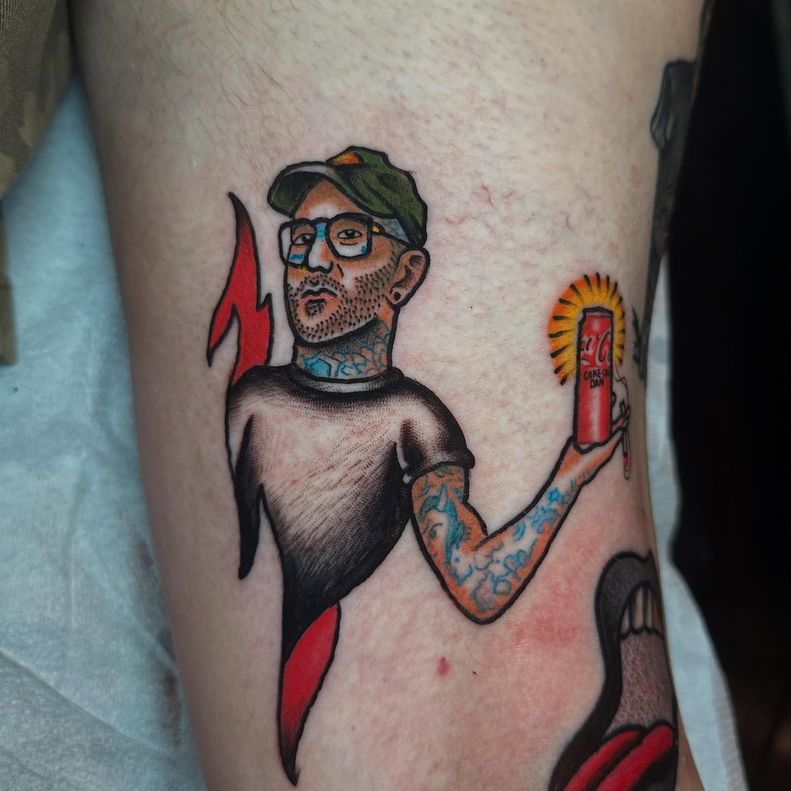 Man holding drink American traditional tattoo on the forearm by Chris Bishop