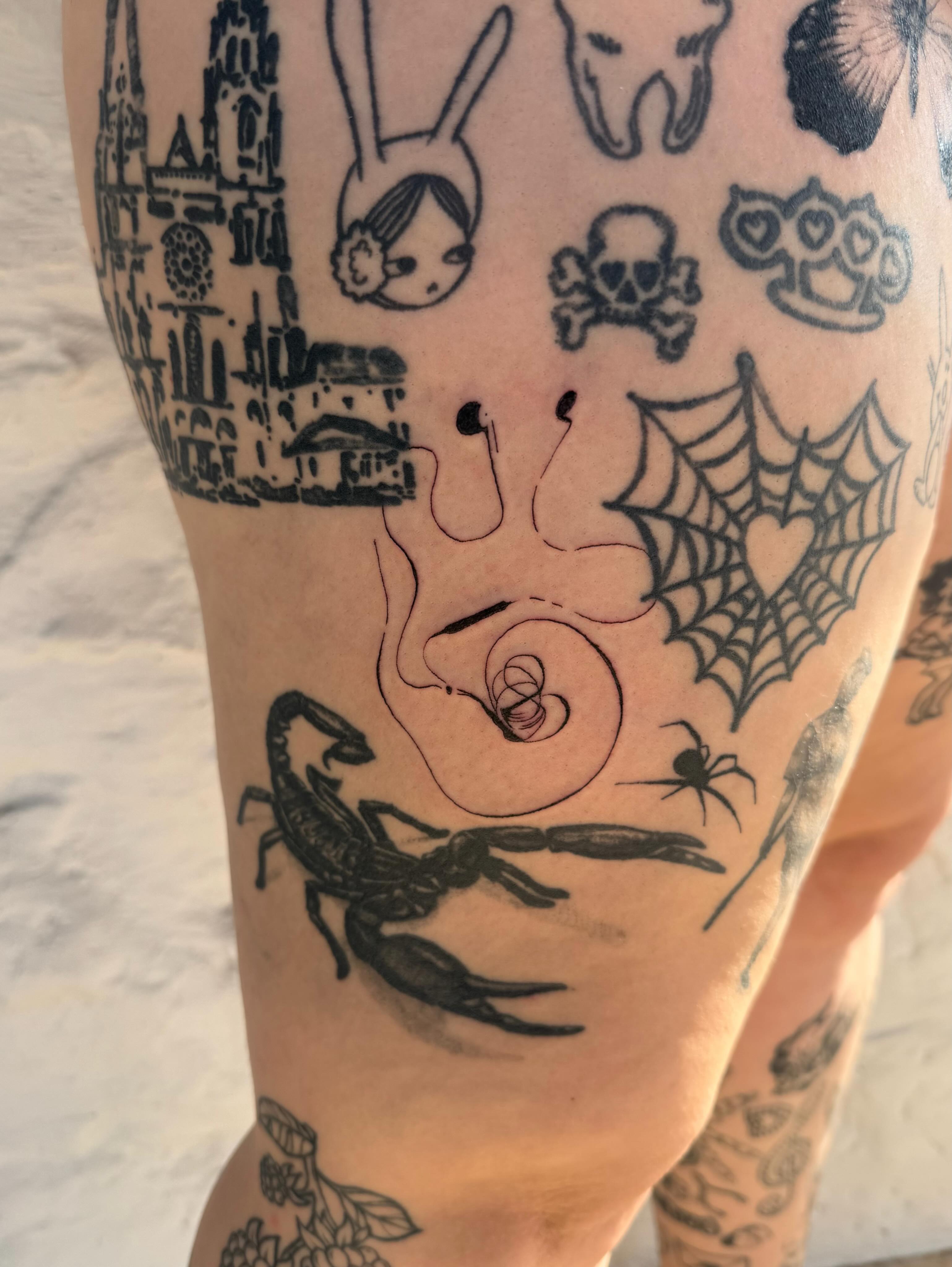 Spiderweb and scorpion black and grey tattoo on the thigh by sarah
