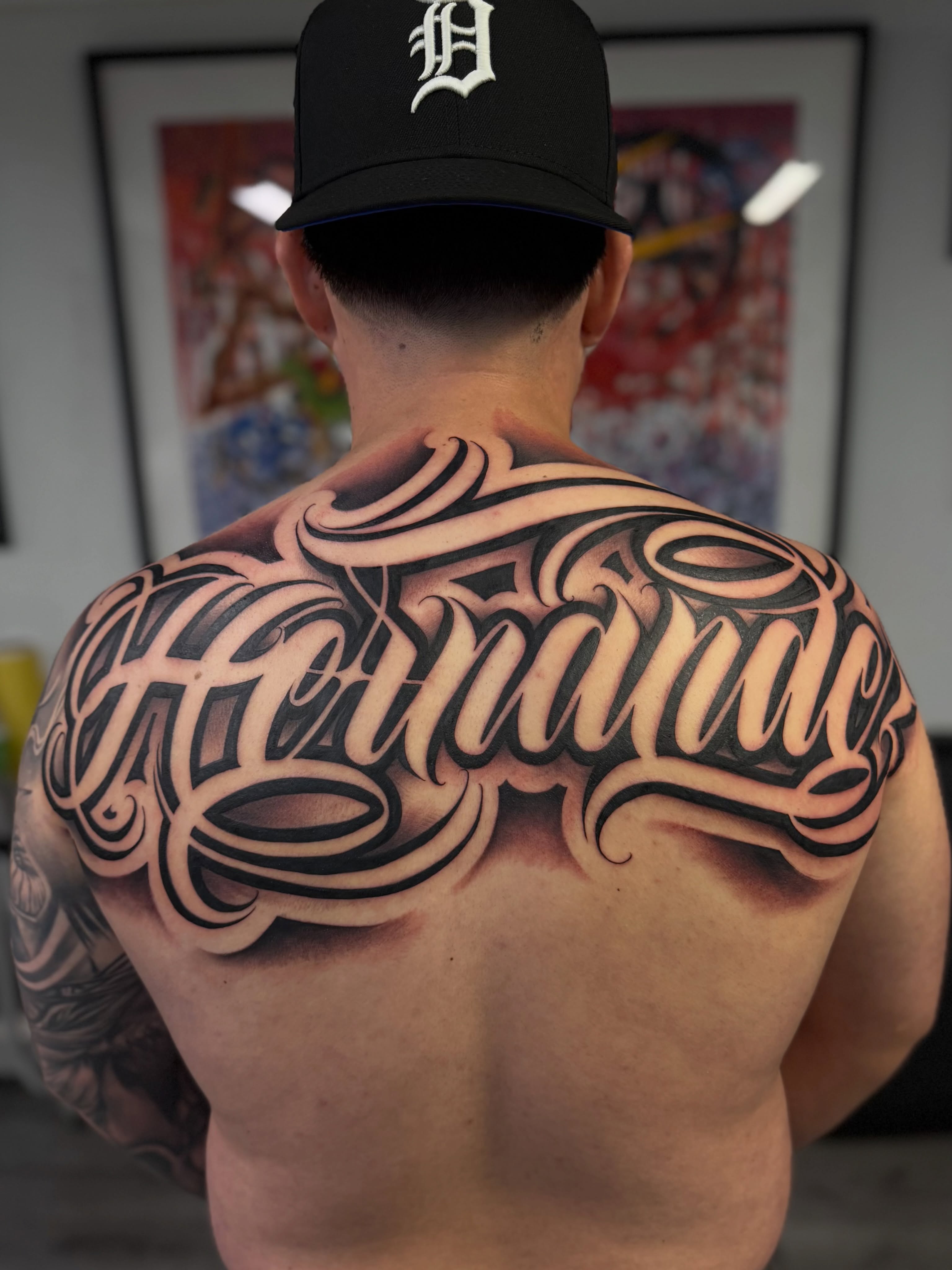 Script lettering lettering script tattoo on the back by Rocky G Inkz LLC