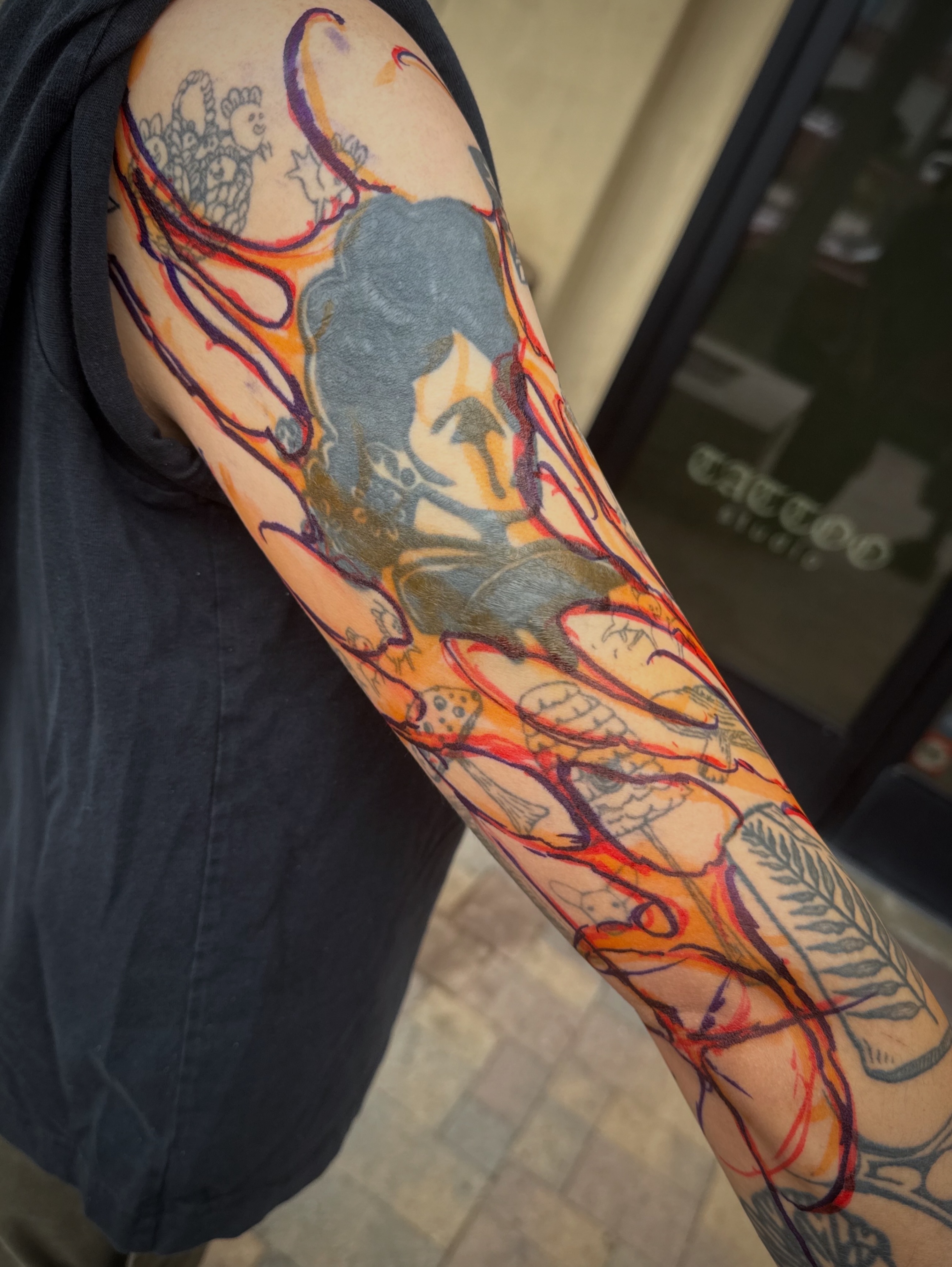 Abstract figure with flowing lines new school tattoo on the upper arm by Rory Somerville
