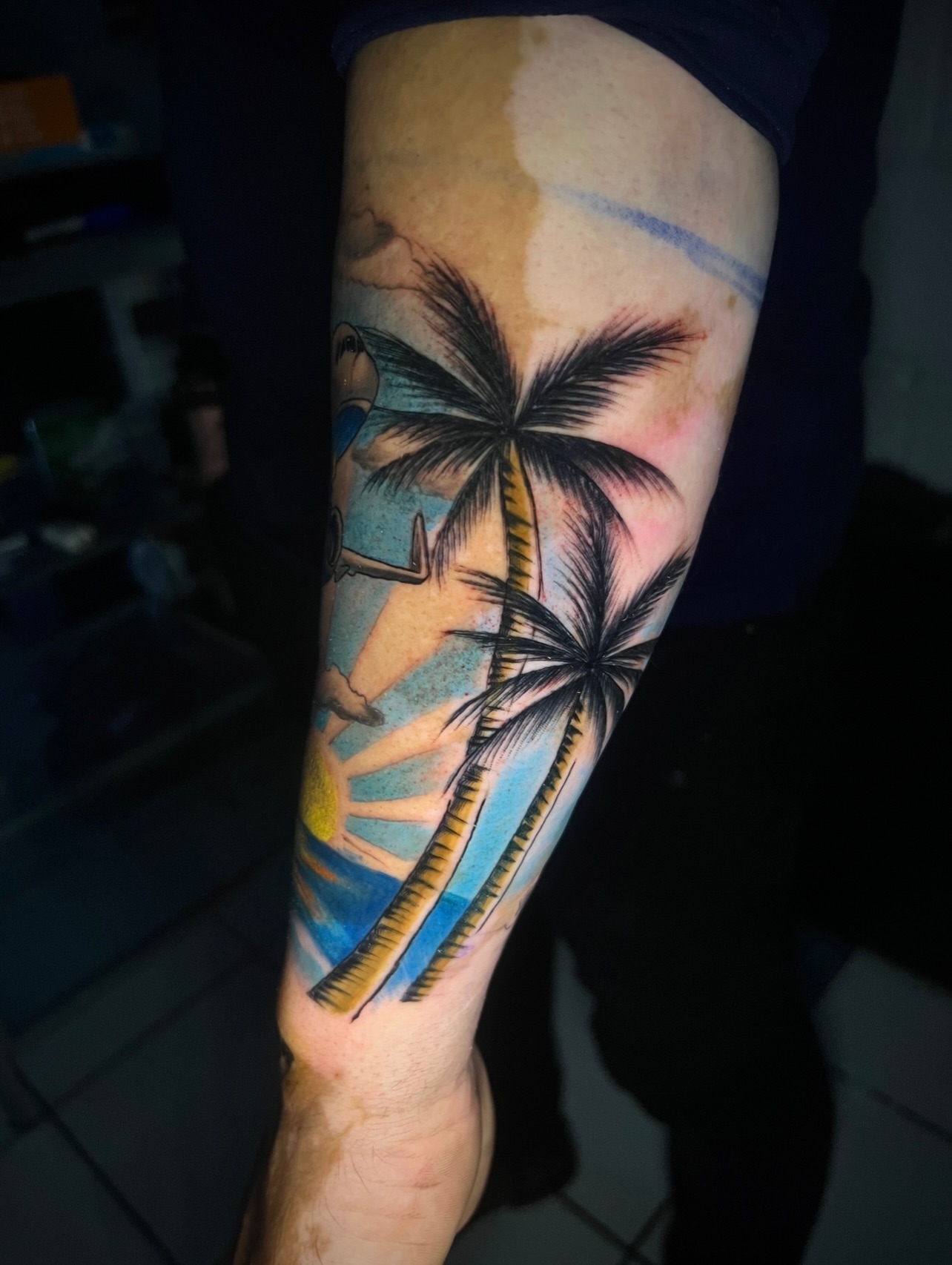 Beach scene new school tattoo on the forearm by El Salvador Tattoo Artist