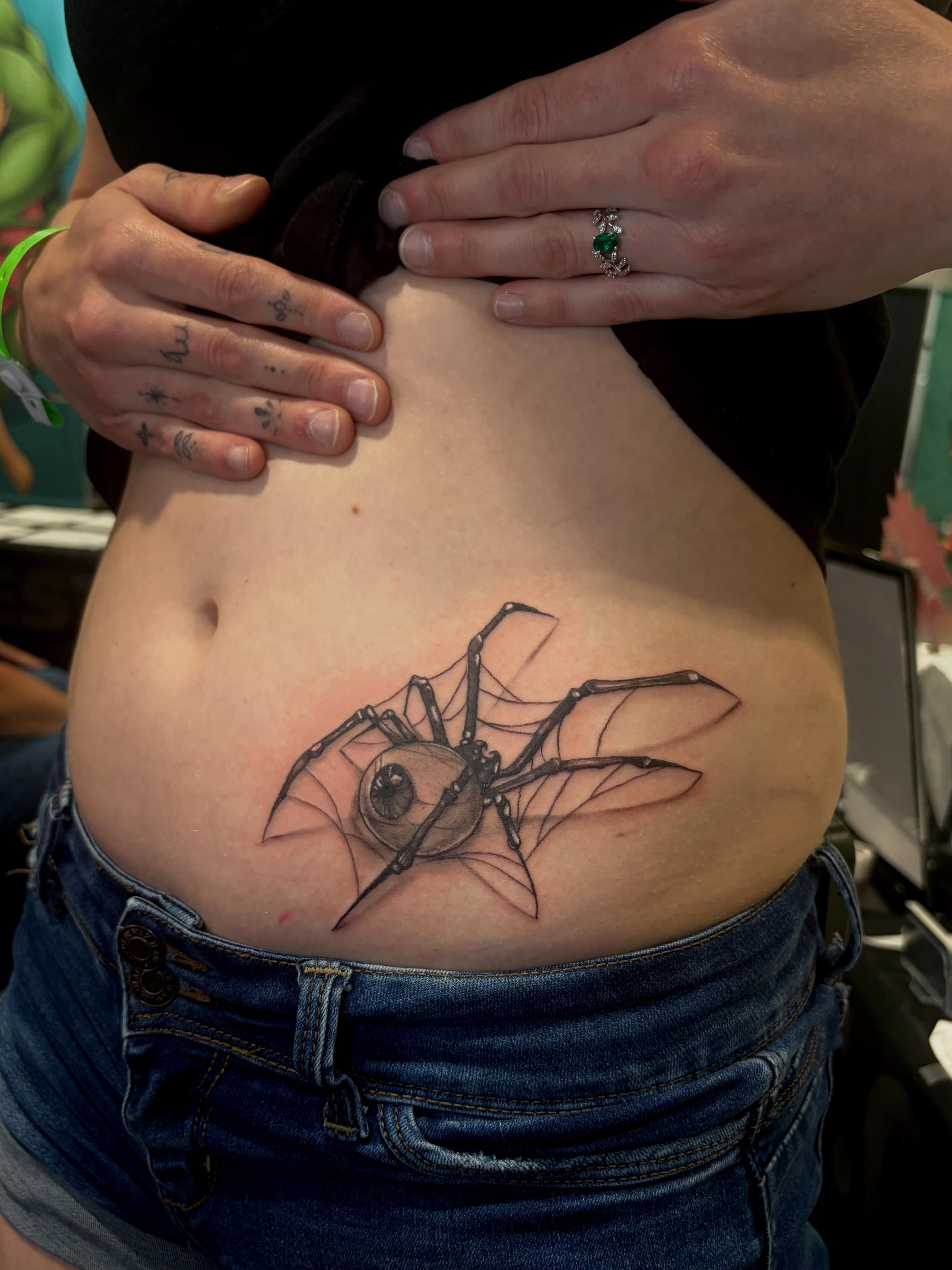 Spider realism tattoo on the ribs by Cyko Hernandez
