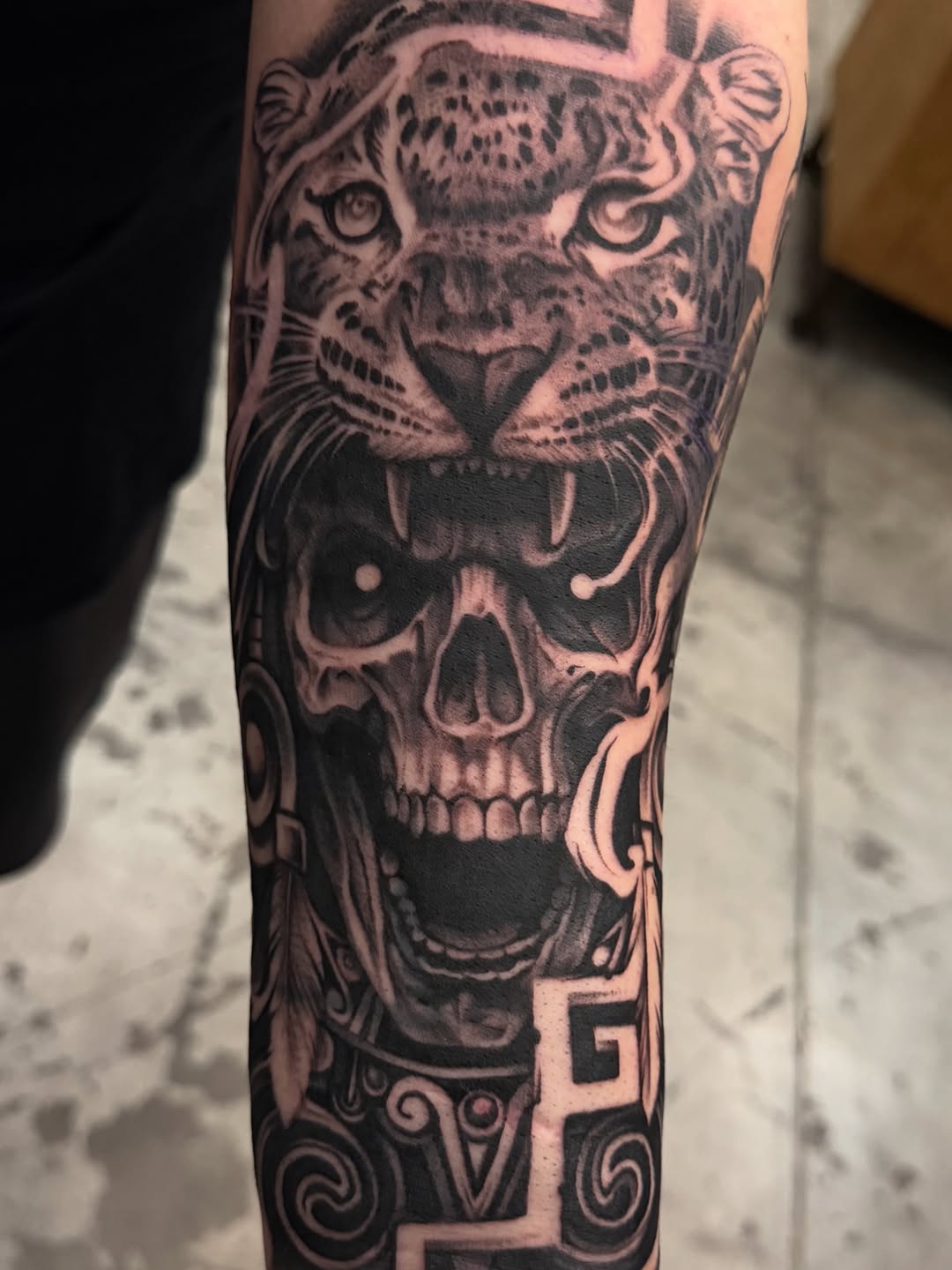 Jaguar and skull realism tattoo on the forearm by Las Vegas tattoo Artist