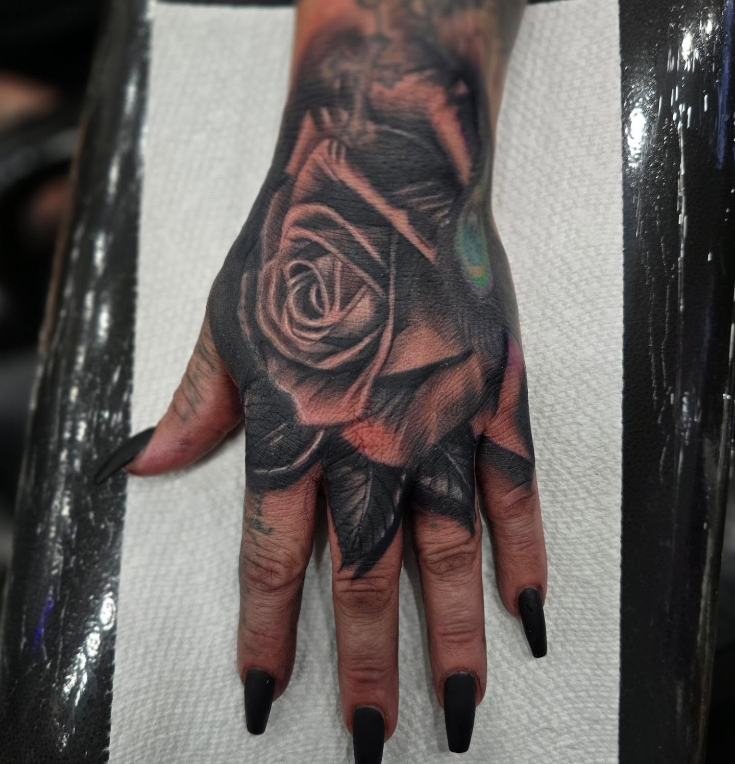 Rose realism tattoo on the hand by Richie Garcia, Hesperia, California