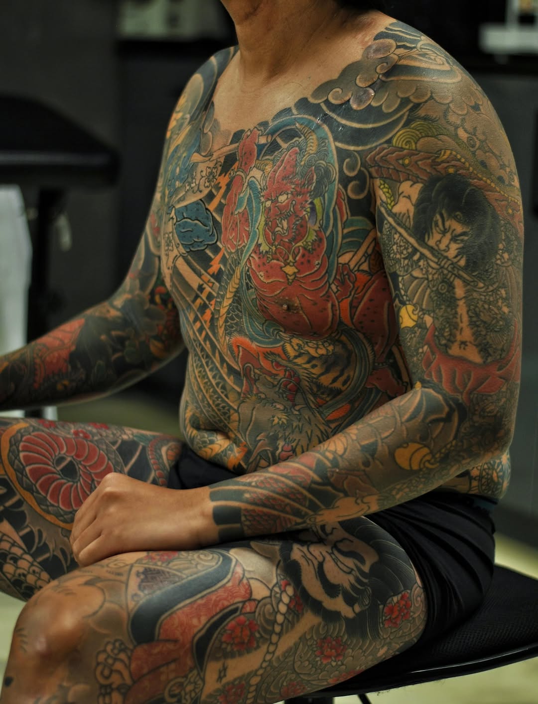 Oni and samurai Japanese tattoo on the torso by Xiaojun Yin, Vancouver, British Columbia