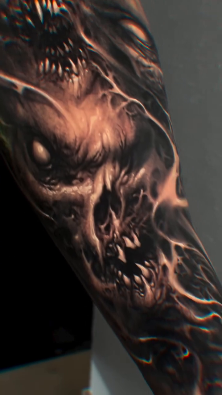 Demonic creature sleeve realism tattoo on the upper arm by David Jorquera