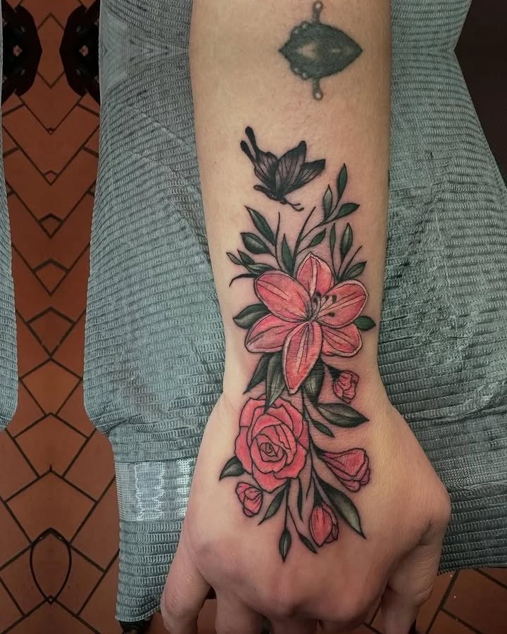 Butterfly and flowers fine line tattoo on the forearm by Rafael Lubowitz