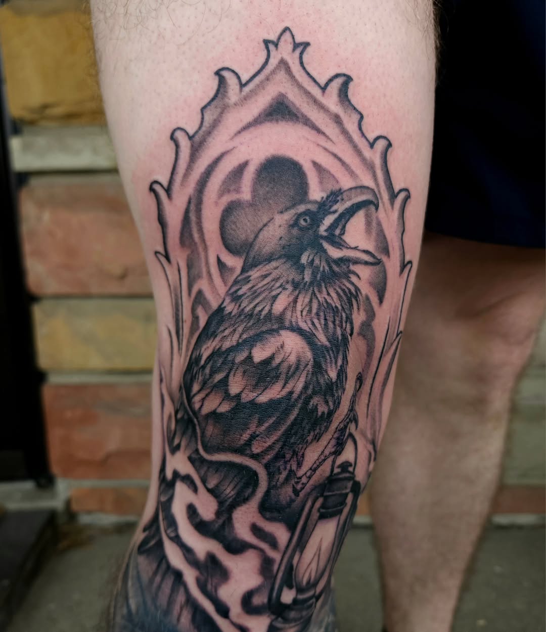 Raven and lantern dark art tattoo on the forearm by Chris Wodarski