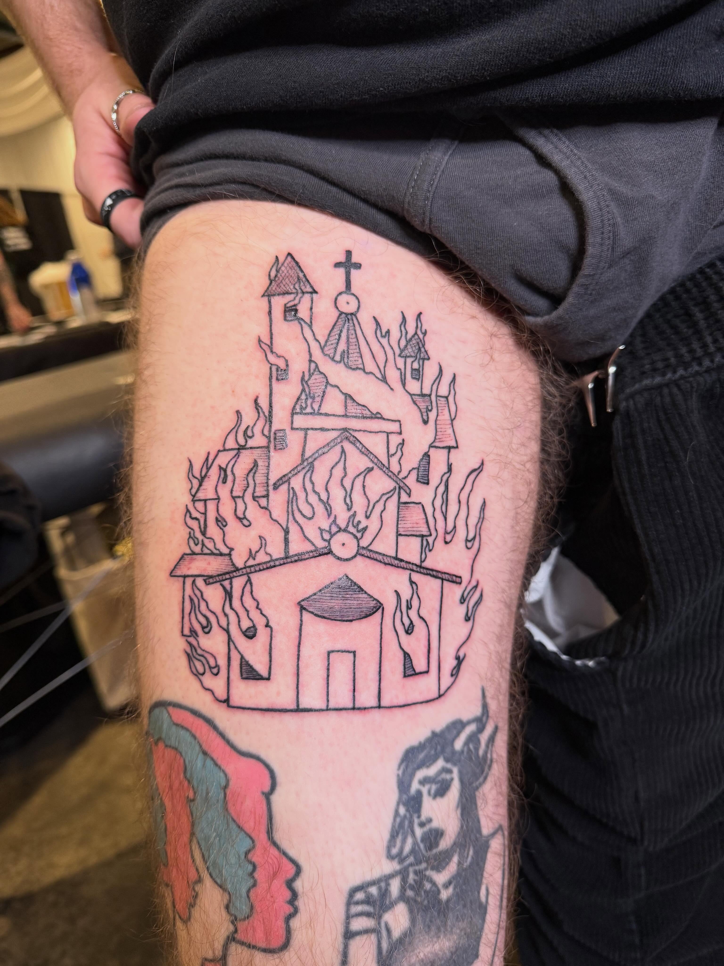 Burning church American traditional tattoo on the thigh by Eric Guntor, Philadelphia, Pennsylvania