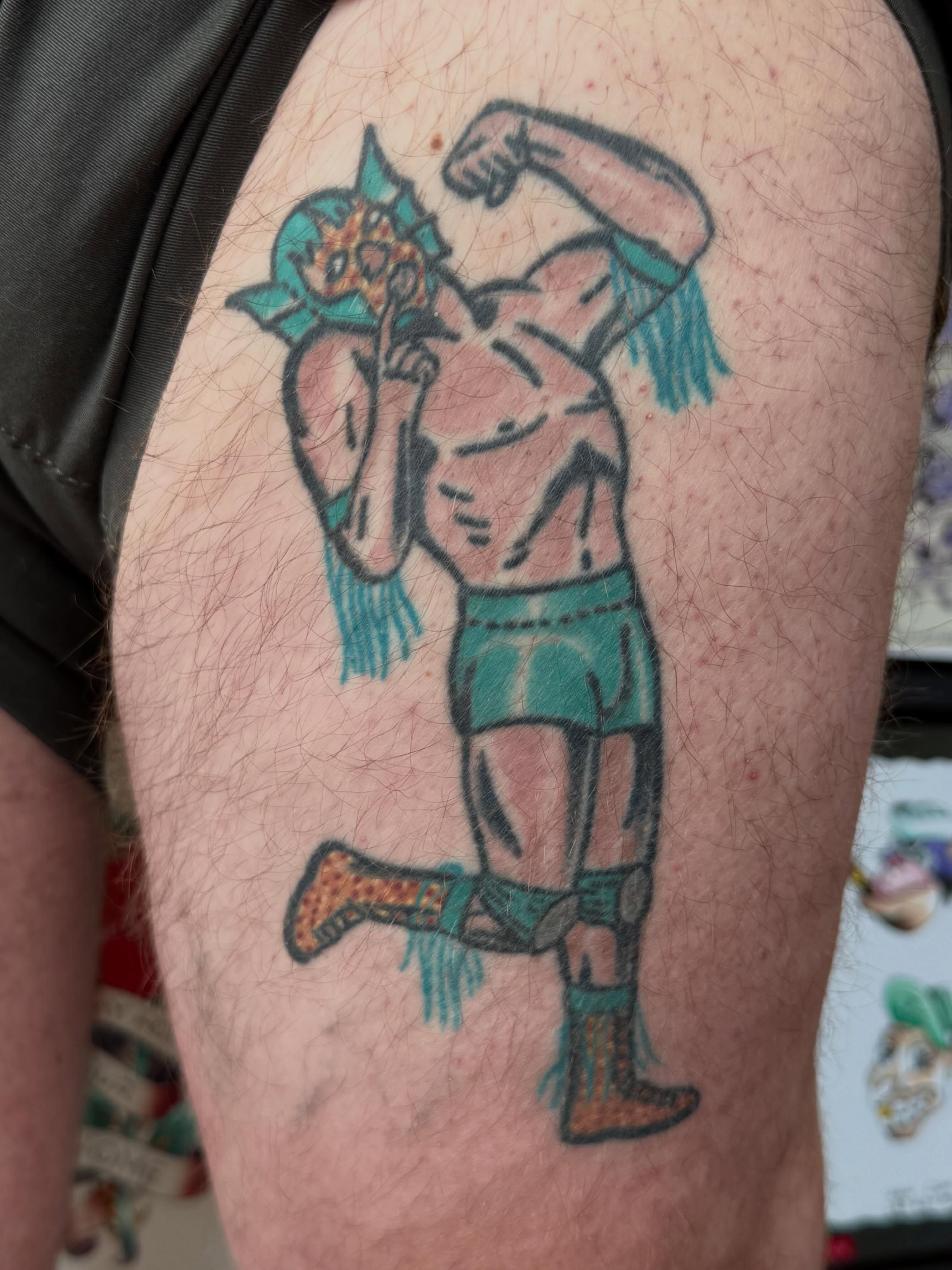 Muscle man American traditional tattoo on the thigh by Timothy Kenee