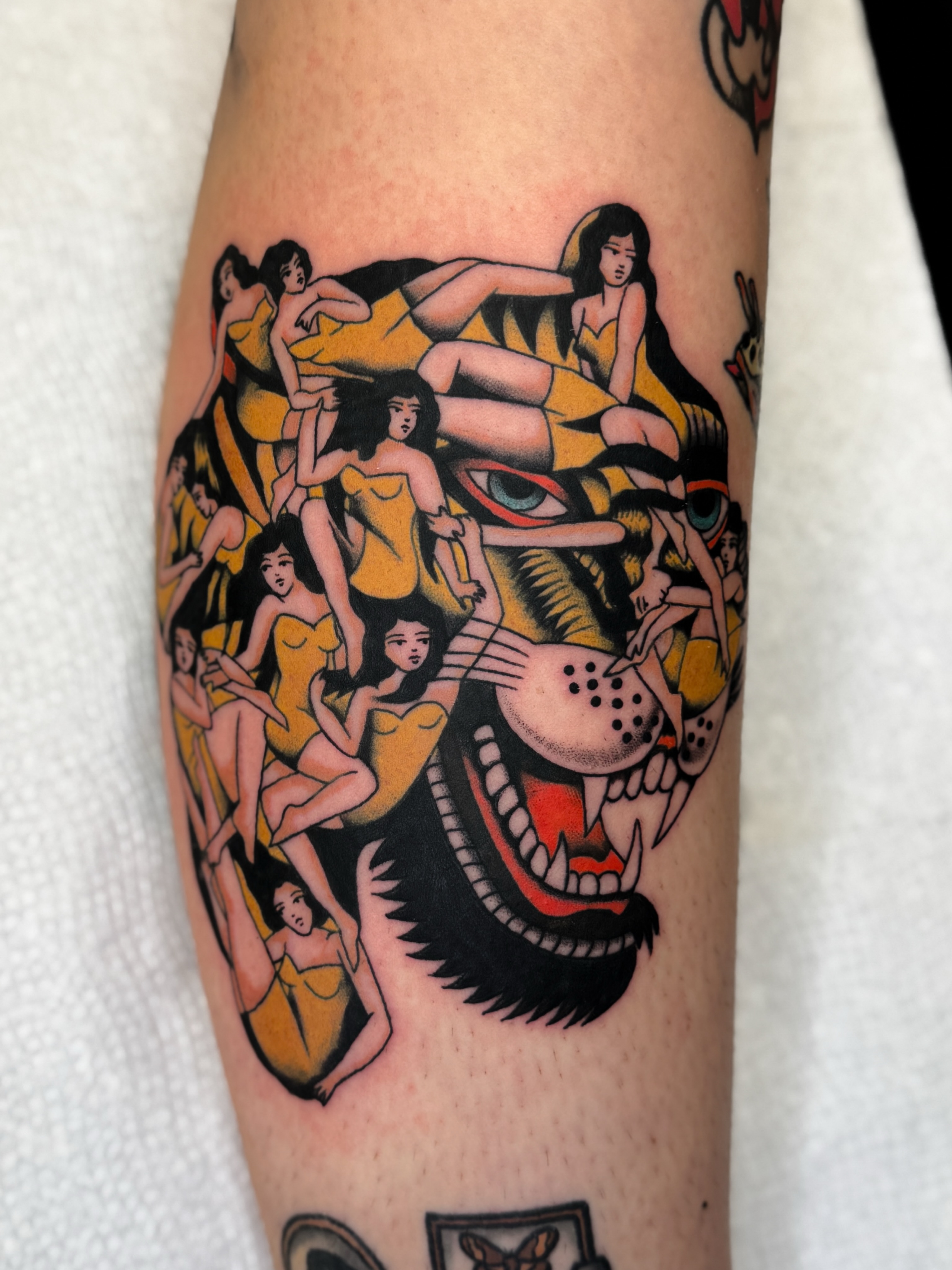Lion and women American traditional tattoo on the forearm by Allie Barringer