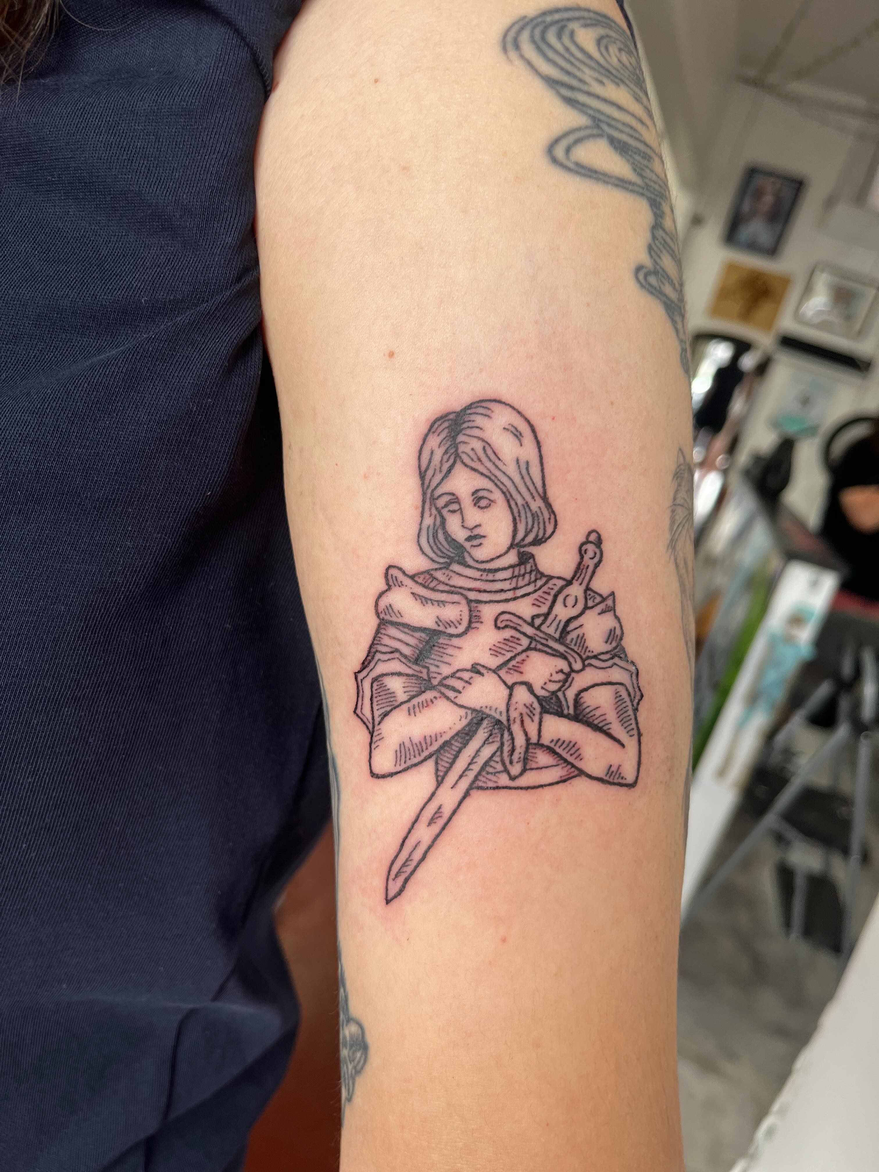 Medieval knight black and grey tattoo on the forearm by Rafaela Lopez