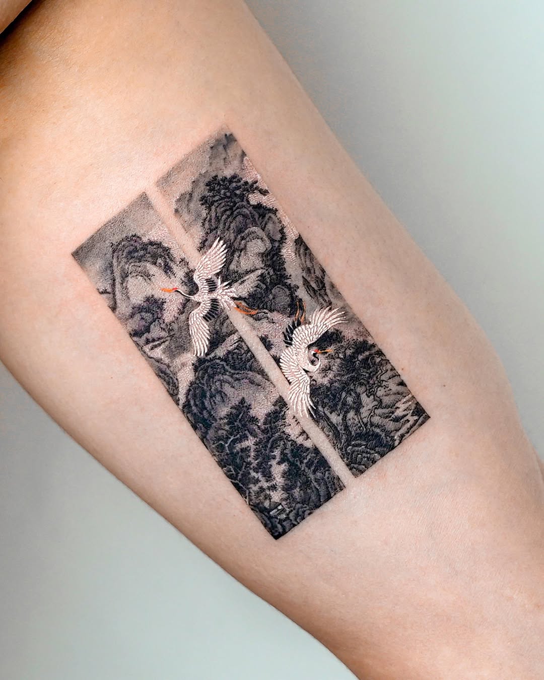 Cranes and landscape fine line tattoo on the forearm by EQ