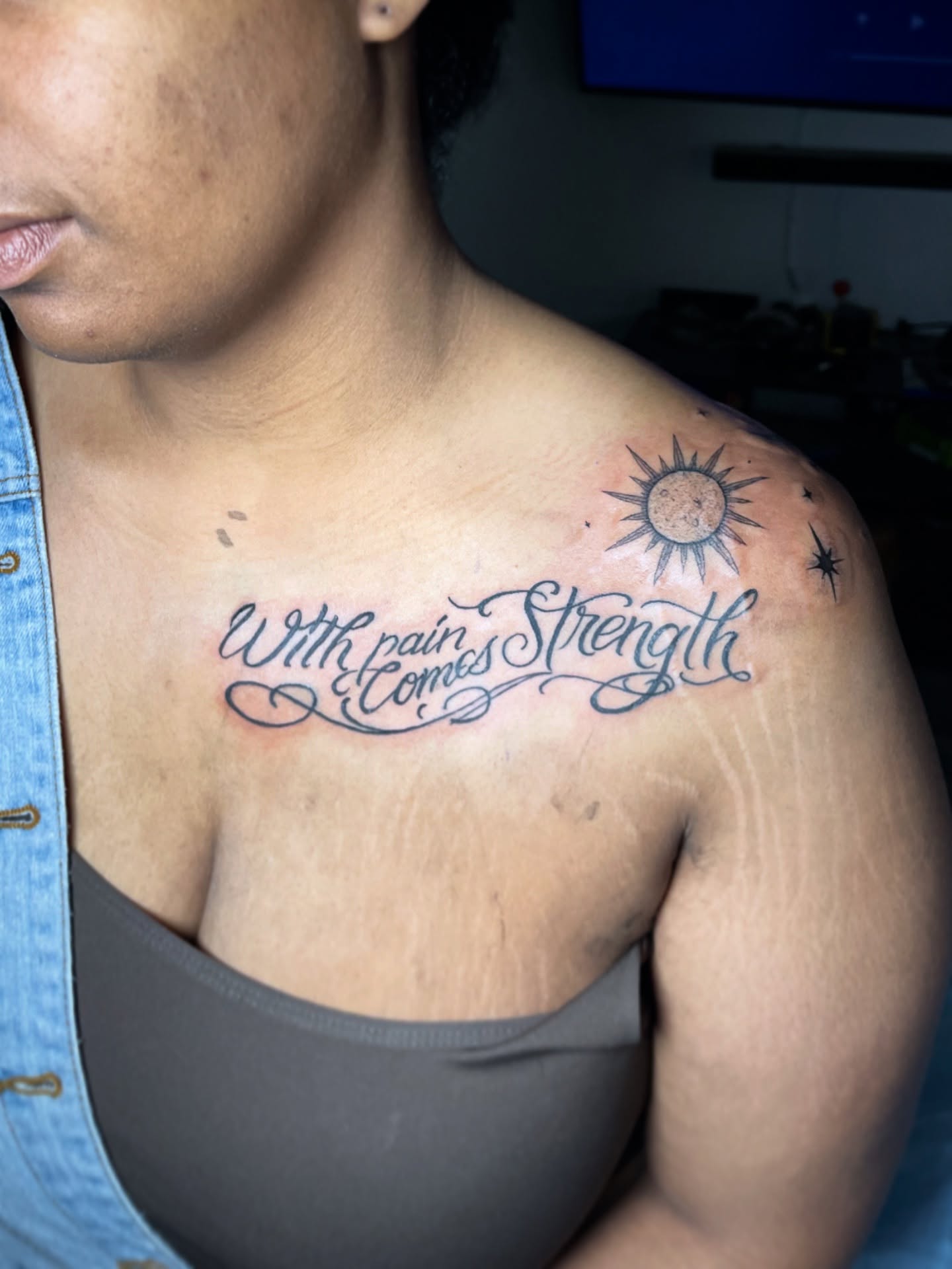 With pain comes strength lettering script tattoo on the shoulder by The Reelist Ink