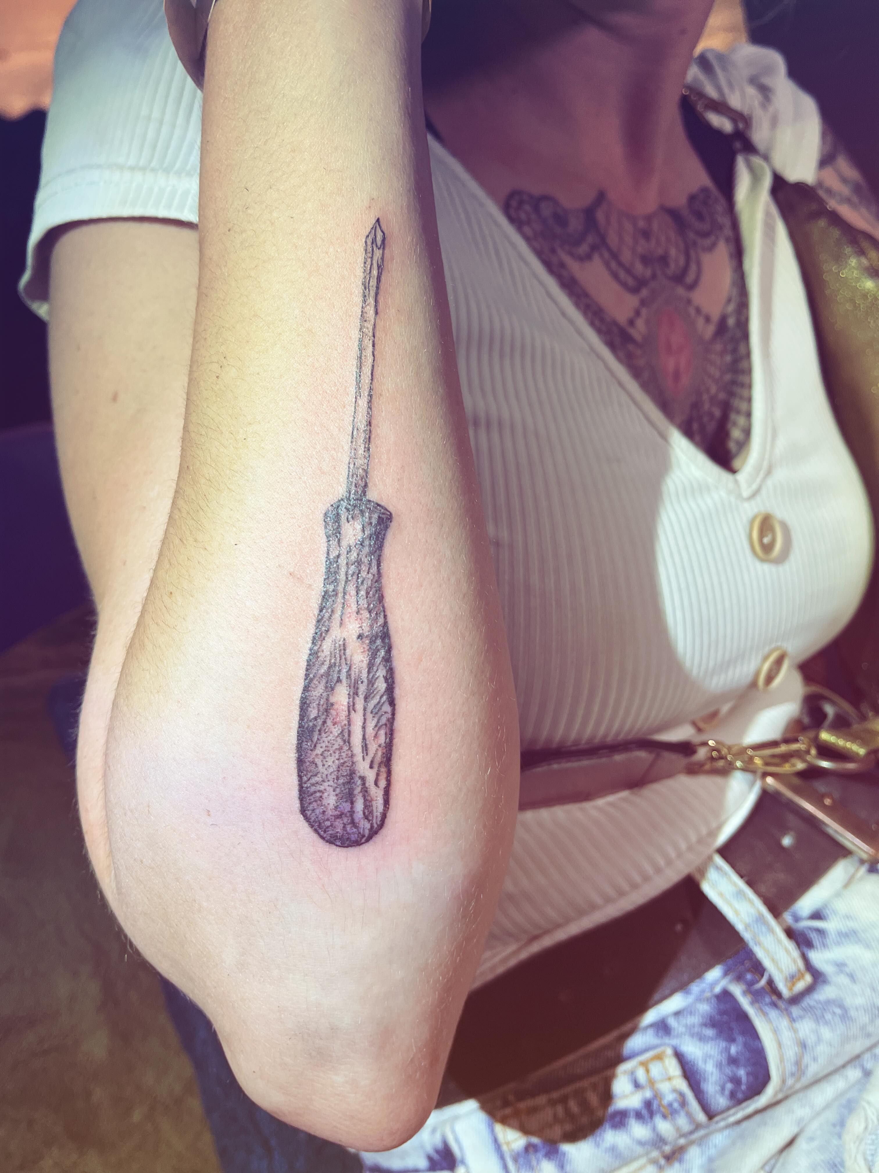 Screwdriver realism tattoo on the forearm by La Main Bleue