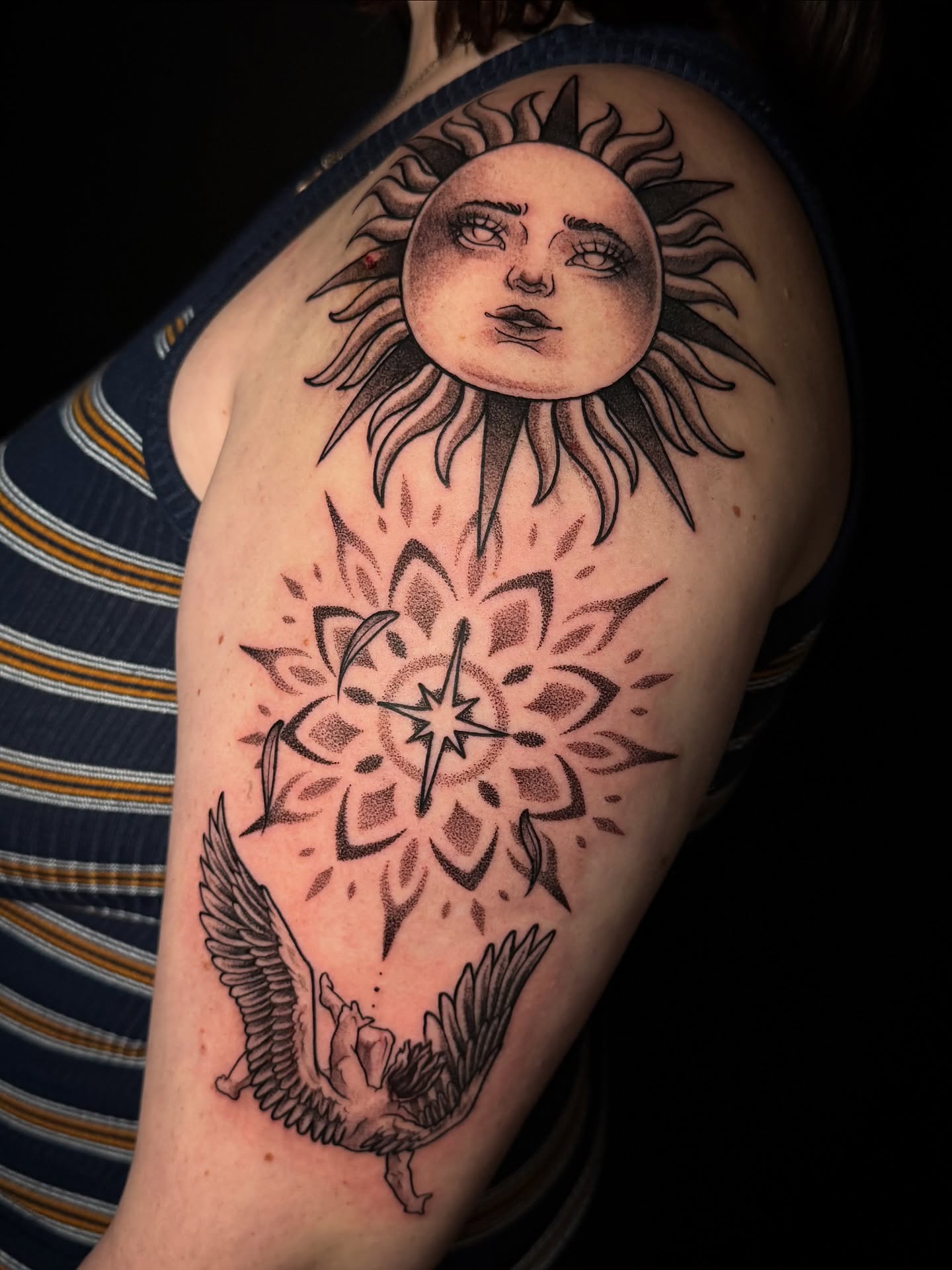 Sun and flower dotwork tattoo on the shoulder by Dee Florian