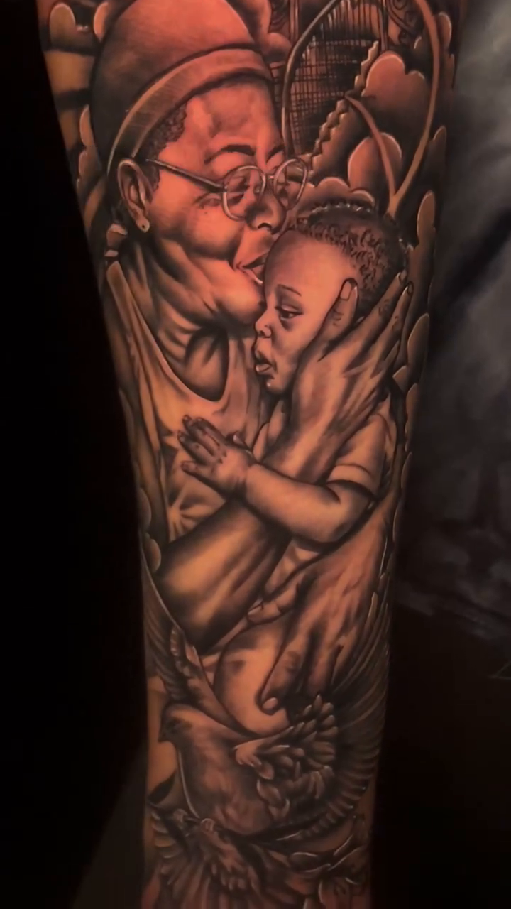 Chicano tattoo on the upper arm by red, Charlotte, North Carolina